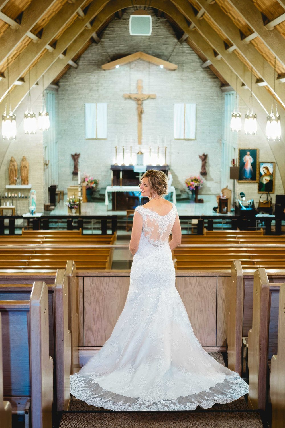 Bride in a church looking back over her shoulder