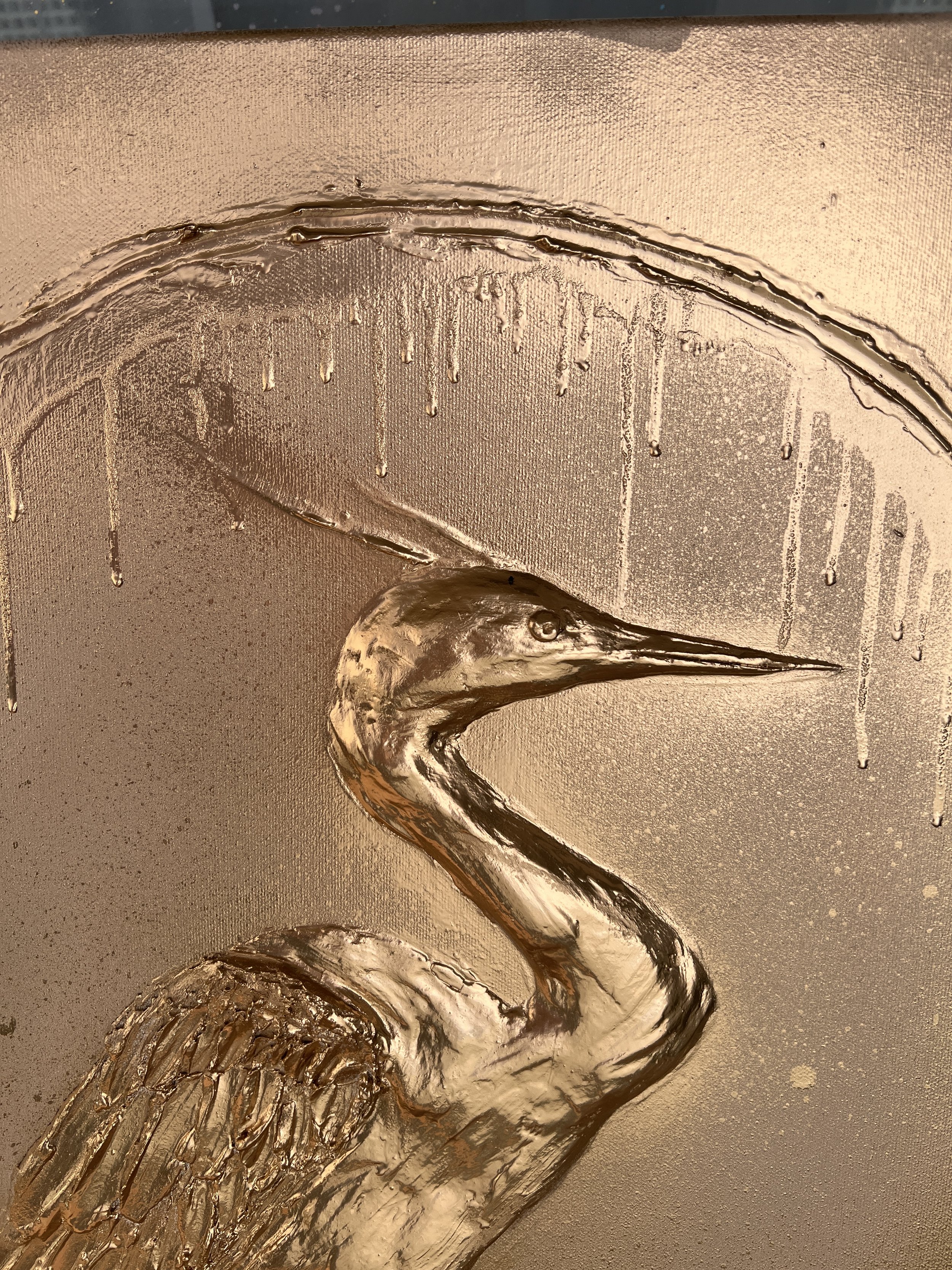 A metallic sculpture of a heron with intricate feather details, set against a textured background with vertical lines and drip-like streaks.