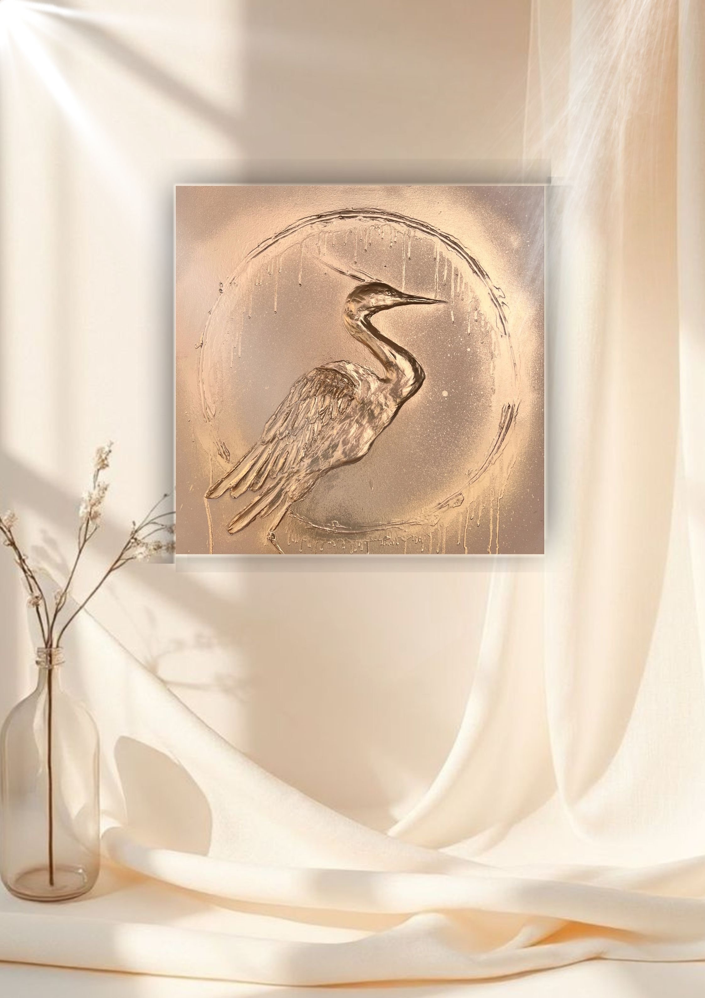Decorative art featuring a heron embossed on a metallic surface, hanging in a room with beige curtains and a glass vase with dried branches.