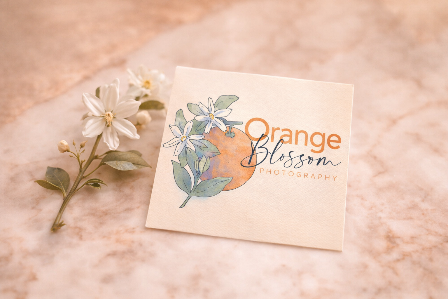 Elegant business card with orange blossoms.png