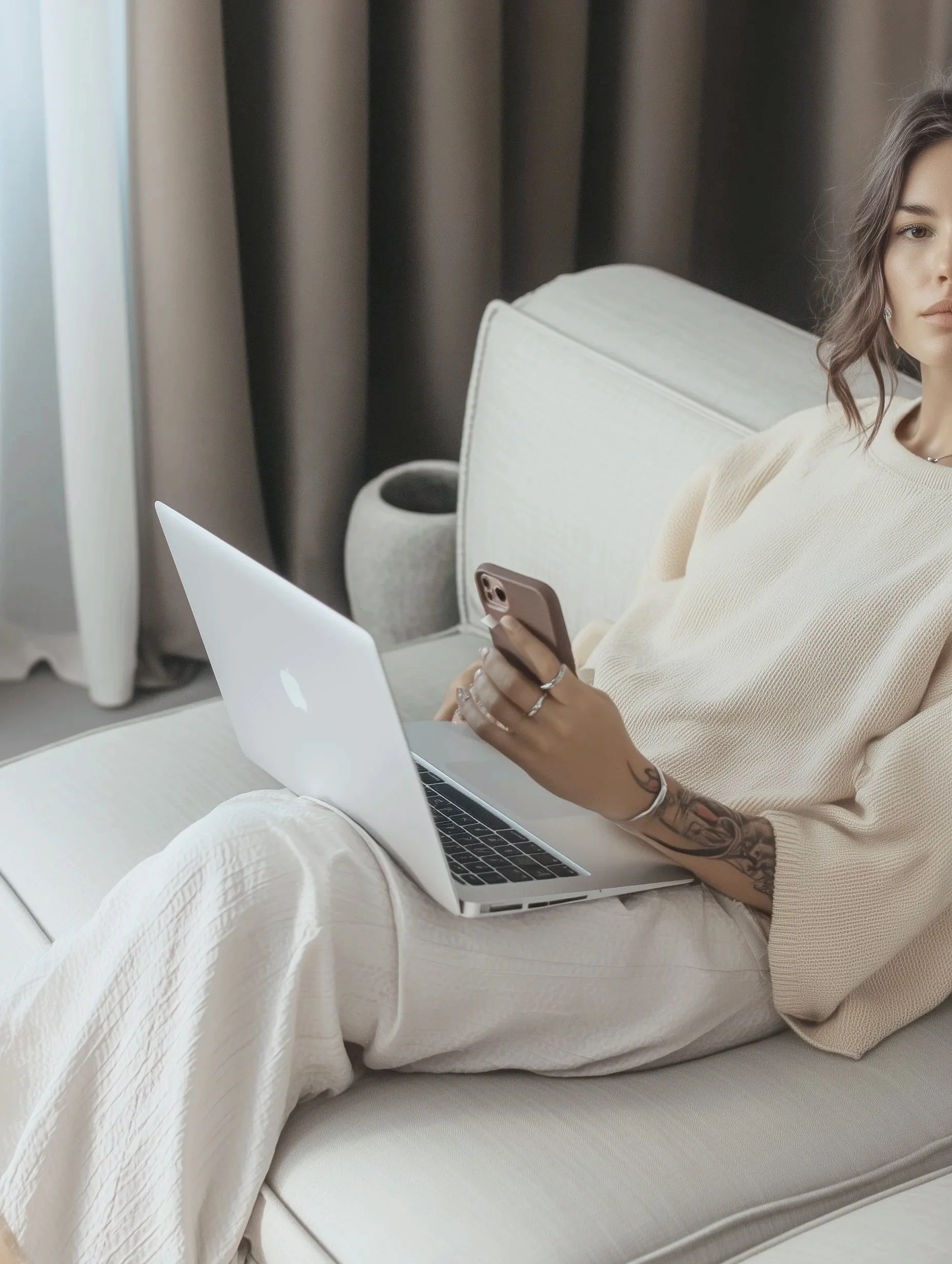 Person holding a digital course guide titled 'Ultimate Digital Guide' against a pink background.