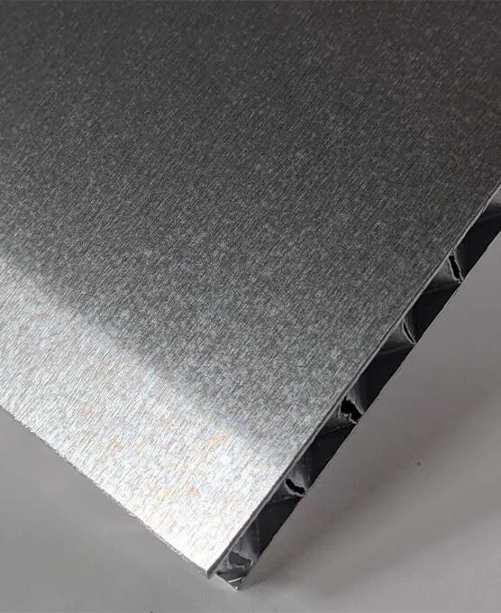 Close-up of an aluminum honeycomb sheet showing internal layers of honeycomb core.