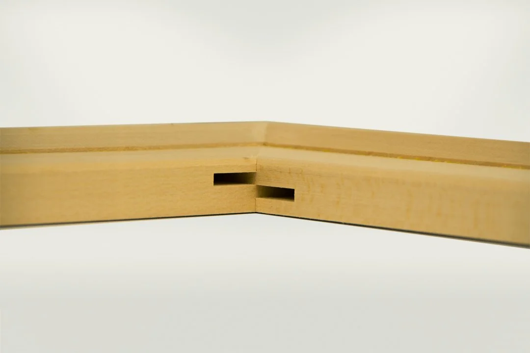 Close-up of a wooden corner joint with a sliding dovetail