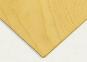 Close-up of a yellow wooden board with a smooth surface and visible wood grain.