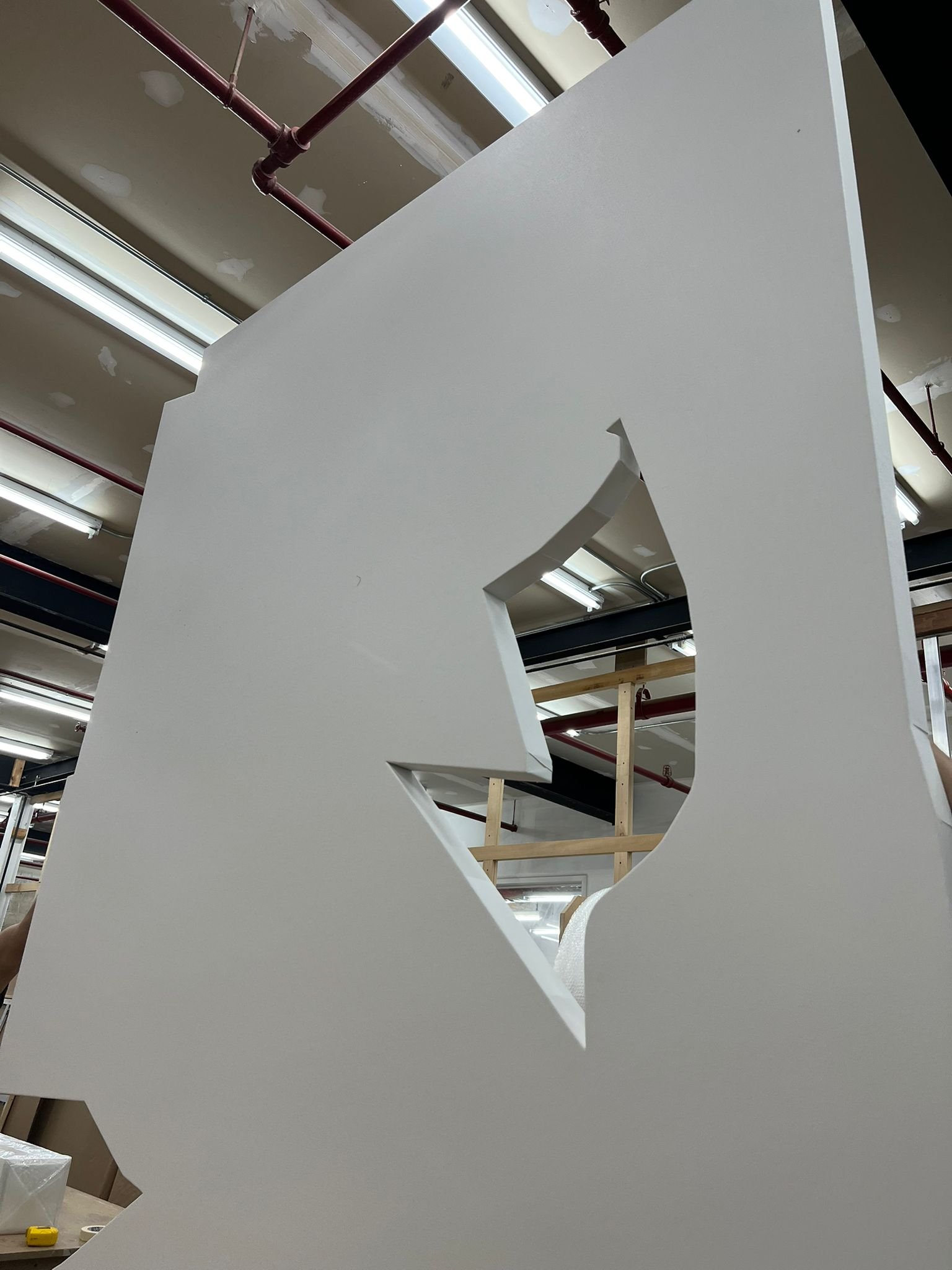 A custom wooden art panel featuring a specific shaped organic cutout.