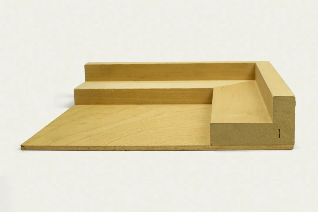 Wooden tiered tray or stand with multiple levels for display.