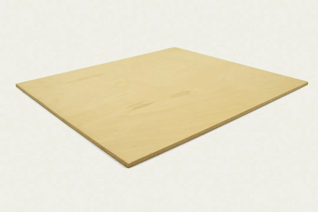A light-colored, rectangular wooden board on a plain white background.