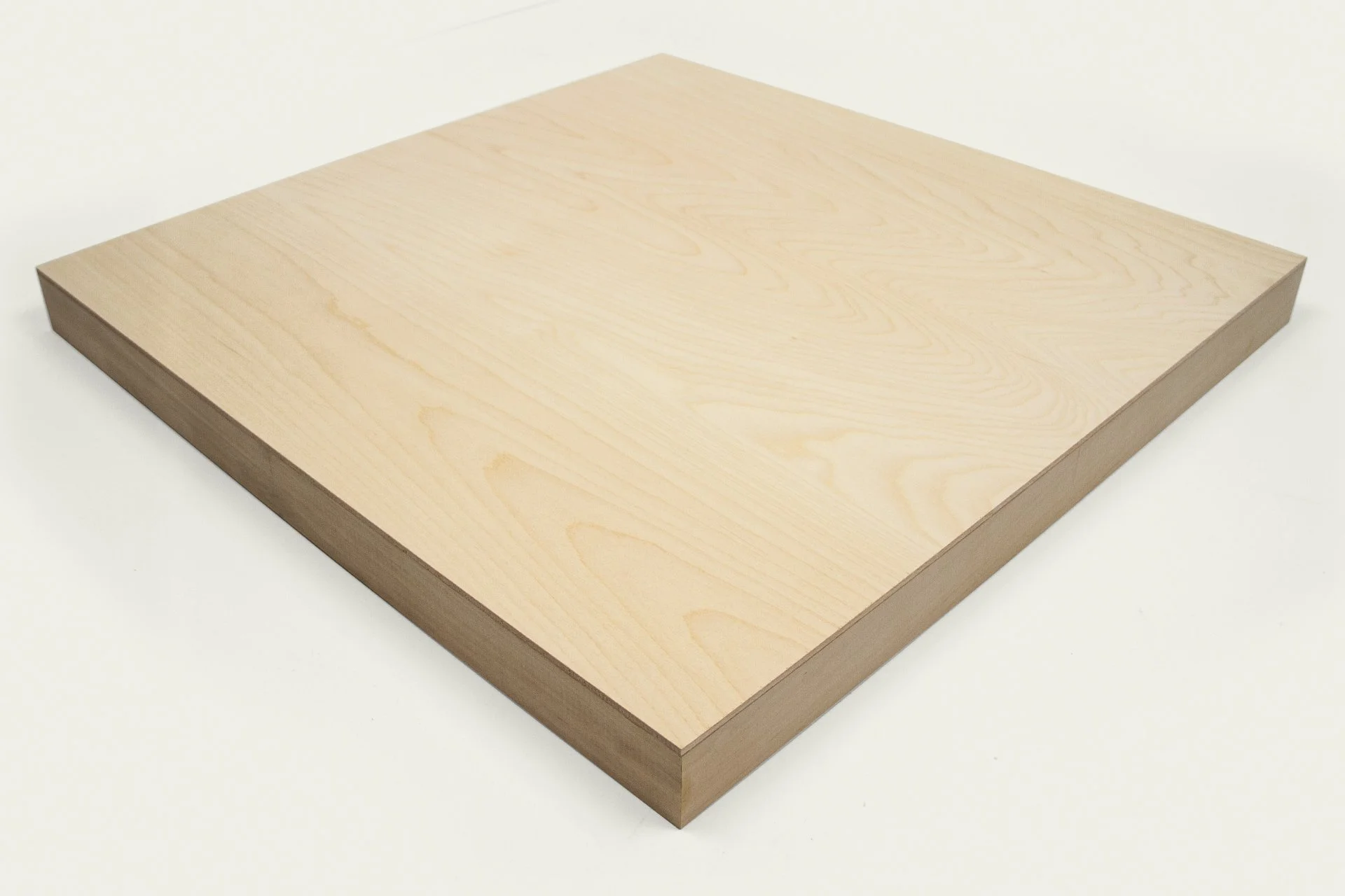 A plain wooden square board with visible wood grain, placed on a white surface.