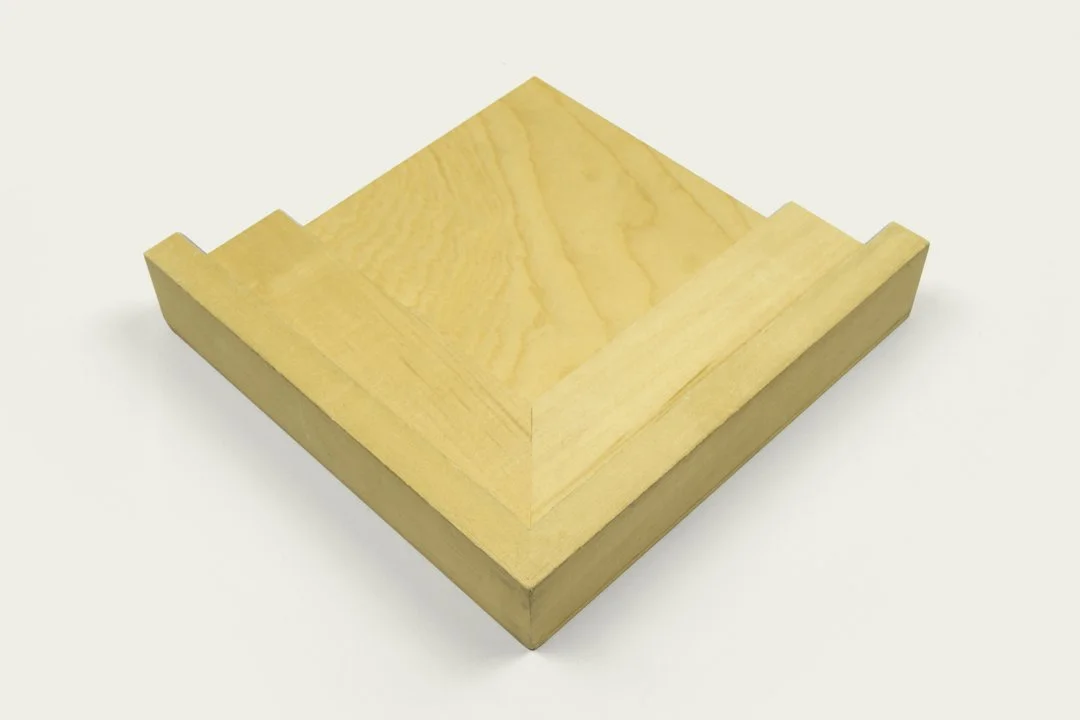 A rectangular wooden tray with raised edges and a sanded surface, made of light-colored wood.