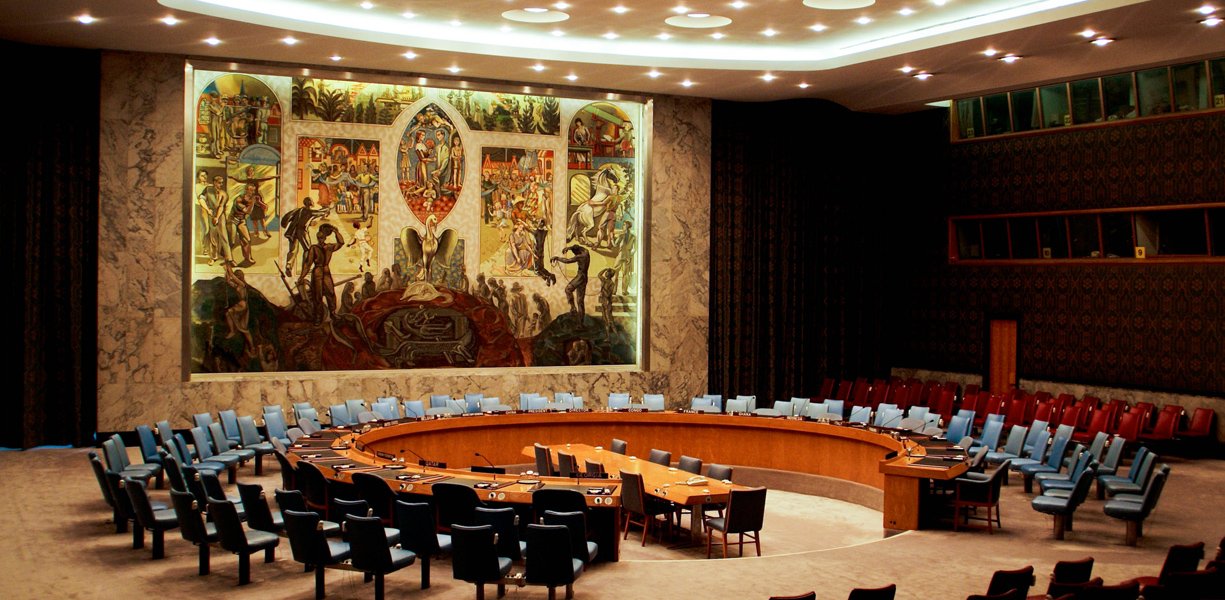 United Nations Security Council meeting room with a large "Untitled Mural for Peace" on the wall behind the seats; Simon Liu, Inc. built a commissioned stretcher for this 18x29 foot support.