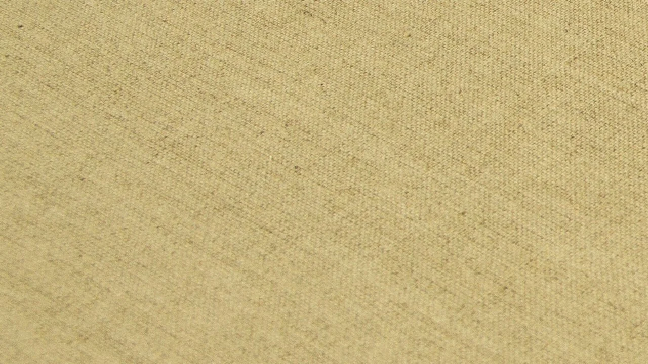 Close-up image of raw canvas with a textured surface.