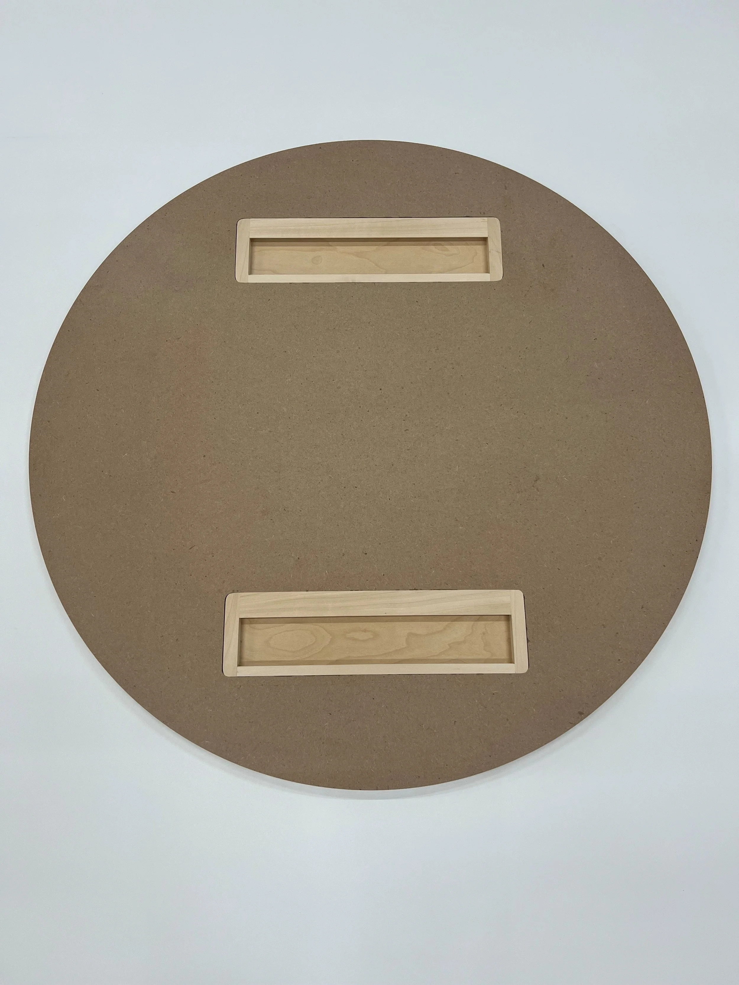 A round tondo art panel with inset horizontal cleats, on a white background.