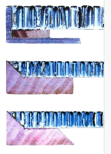 Close-up of different edge treatments for aluminum honeycomb panels; angled aluminum edge with wood filler, wrapped around wooden edge, and wood edge with built in cleats, arranged horizontally.