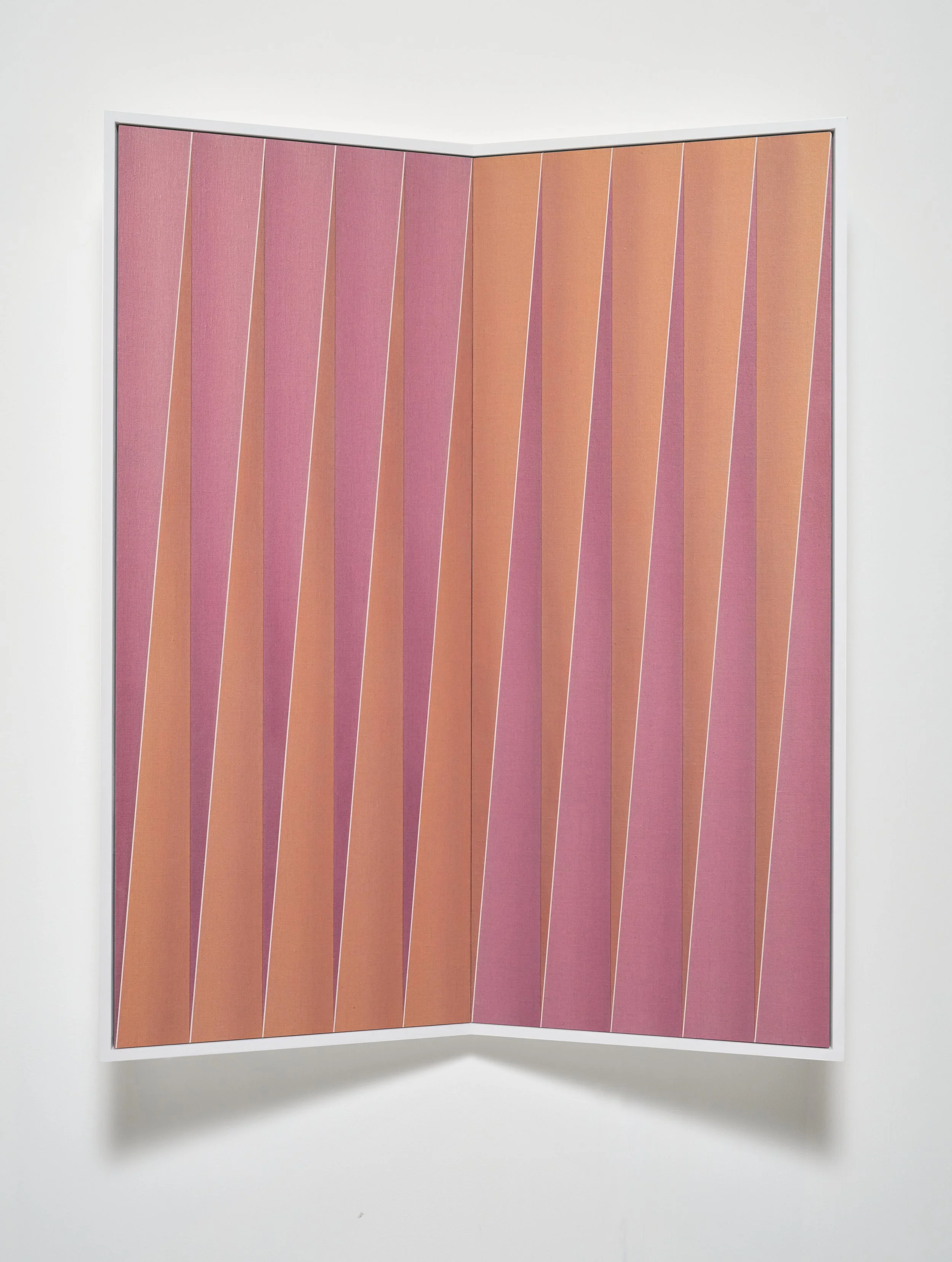 A folded fabric panel with pink and orange diagonal striped patterns, bordered with a white frame, on a plain white background.