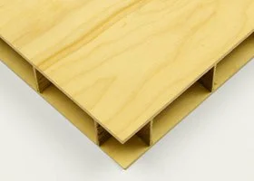 Close-up of a light-colored wooden pallet with multiple slats and hollow sections.