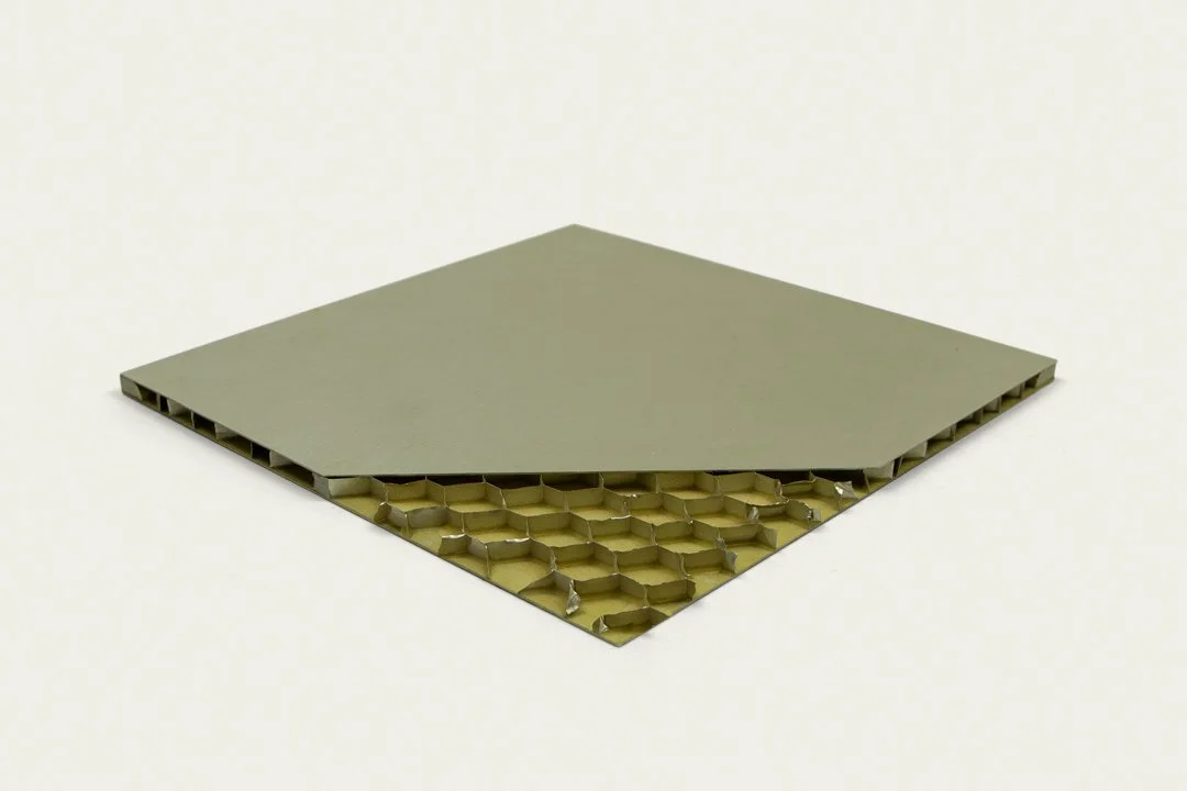 A aluminum honeycomb panel example with a cutout of the honeycomb.