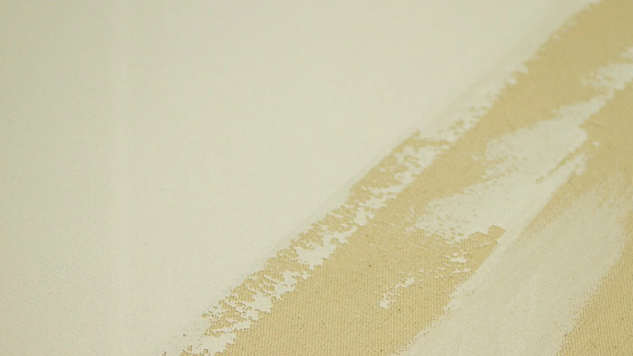 Close-up of a beige canvas with pre-primed gesso (hand-primed in Brooklyn).