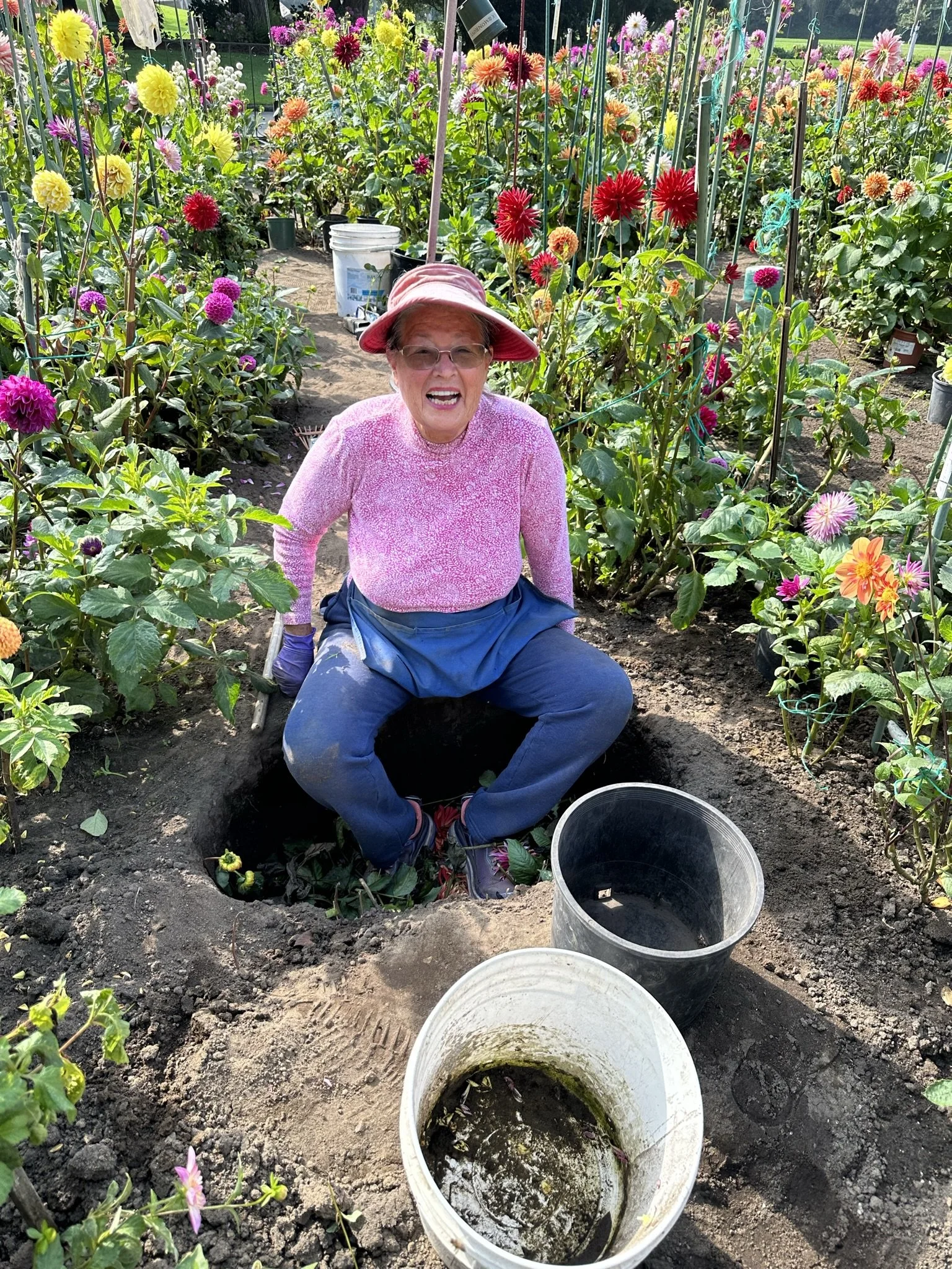 Deb in compost hole.jpeg