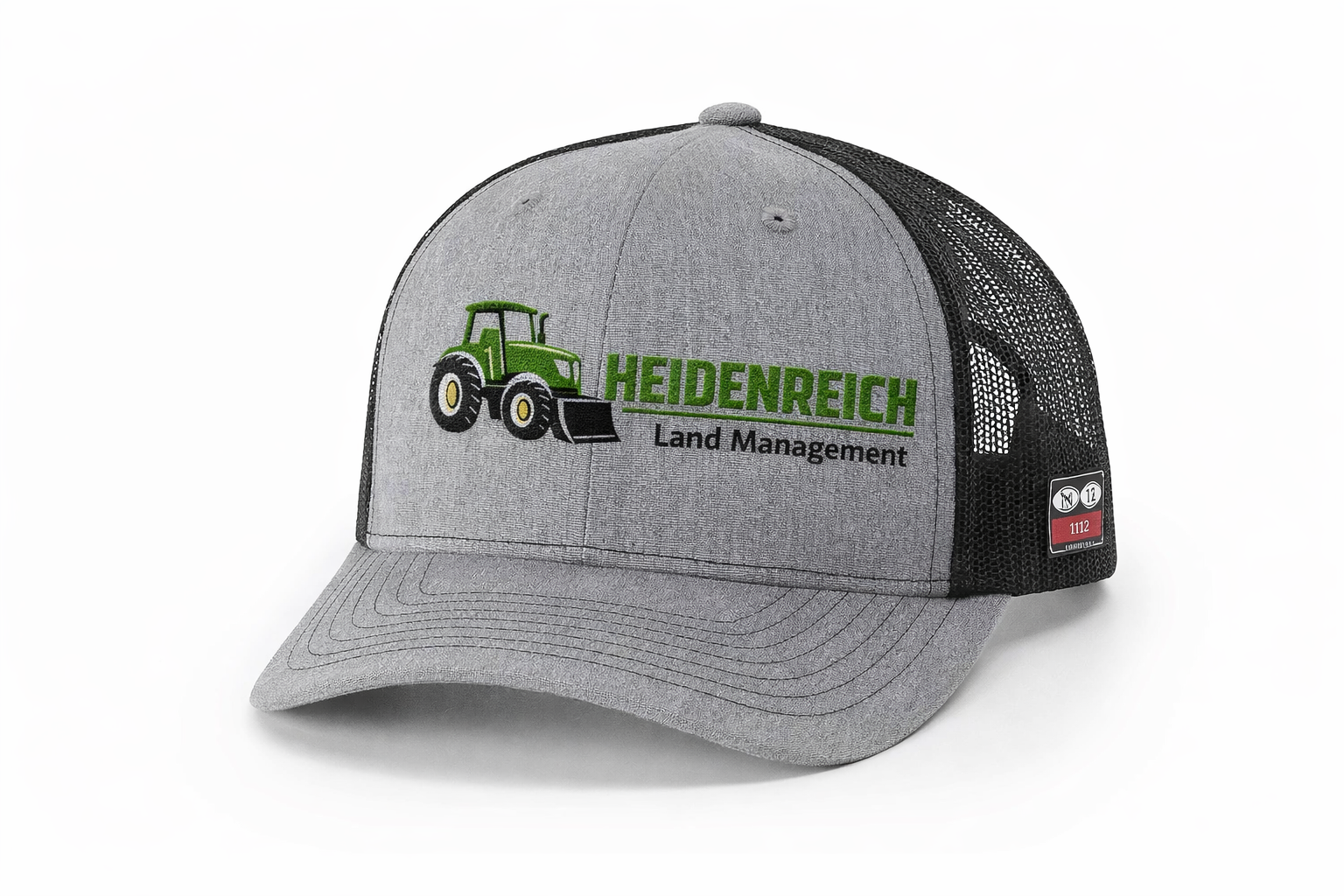 Gray baseball cap with a tractor logo and the words "Heidenreich Land Management" embroidered on the front, and a mesh back panel.