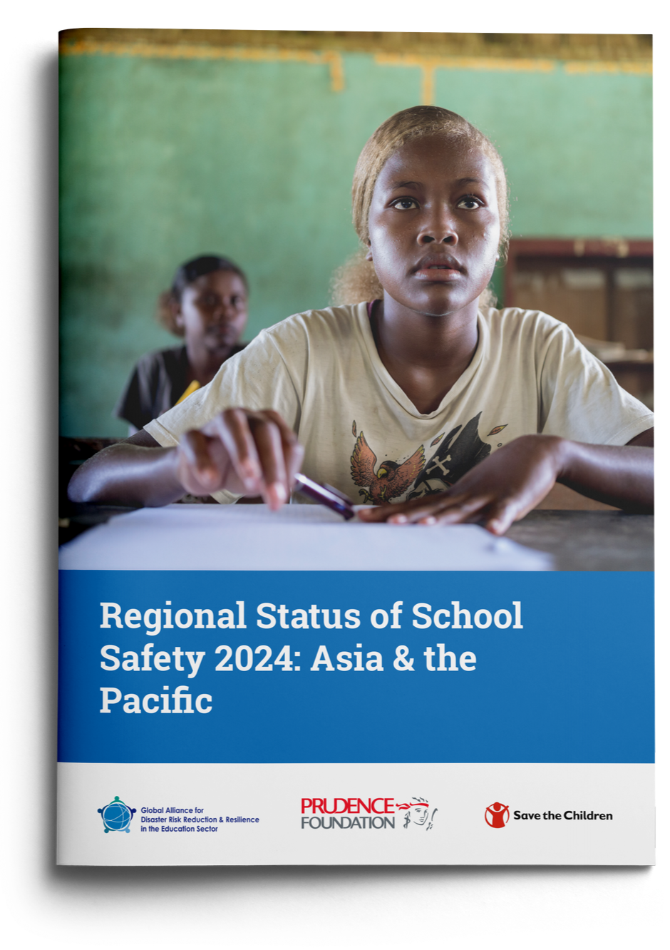 Cover of a report titled 'Regional Status of School Safety 2024: Asia & the Pacific,' featuring a young girl in a classroom, sitting at a desk with a pen and paper, with another student in the background. Logos of the Global Alliance for Disaster Risk Reduction & Resilience in the Education Sector, Prudence Foundation, and Save the Children are at the bottom.