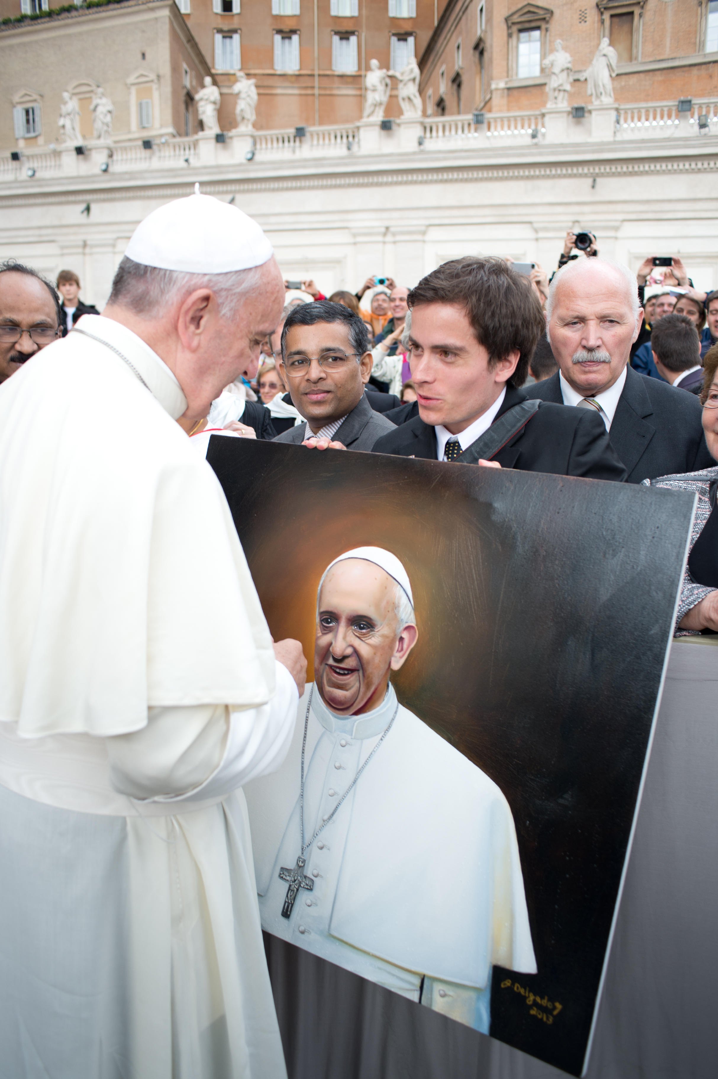 Portrait painting of His Holiness Pope Francis presented at St. Peter's Square in front of St. Peter's Basilica in Vatican City.