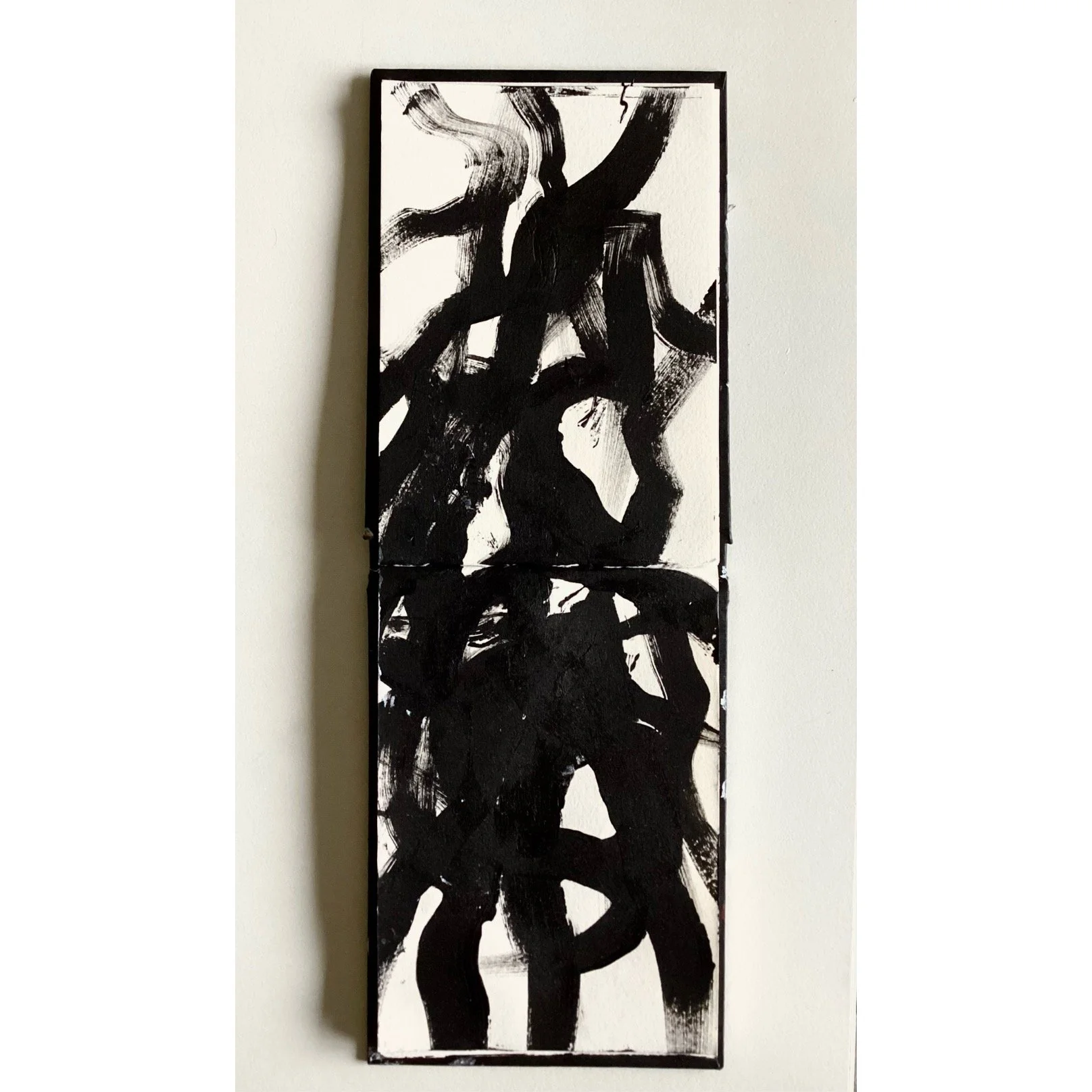 Abstract black and white painting with bold, sweeping brushstrokes on a tall, narrow canvas.