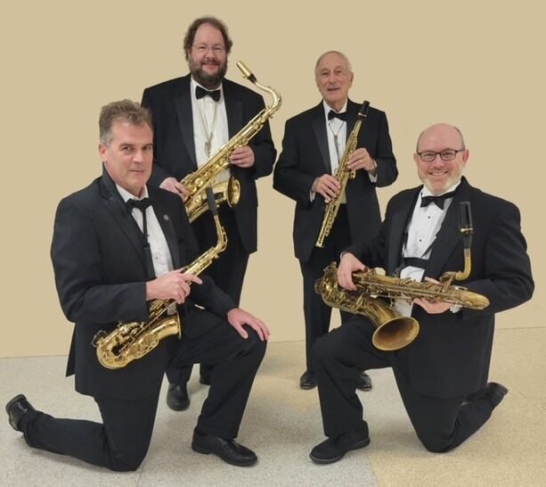 Four gentlemen holding saxophones