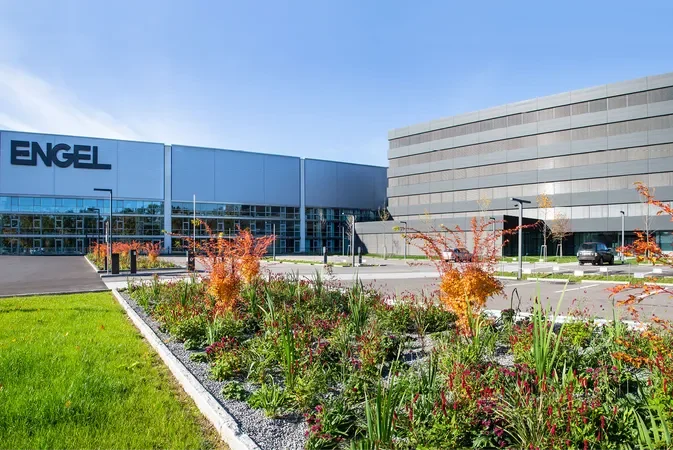 Exterior view of the Engel building with landscaped garden in the foreground and a parking lot to the side.