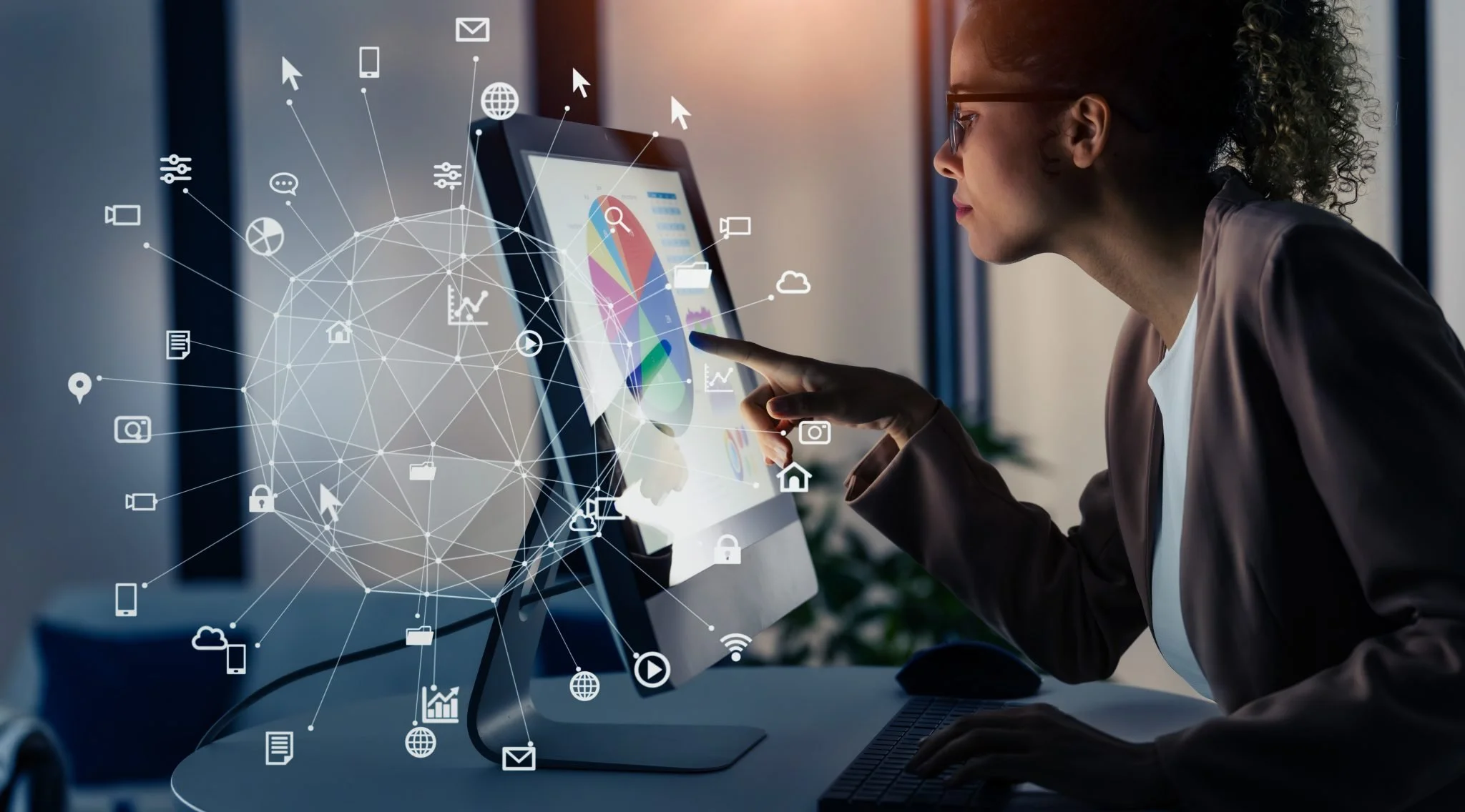 A woman with glasses interacts with a touchscreen computer displaying data visualizations, with digital icons and network lines overlayed.