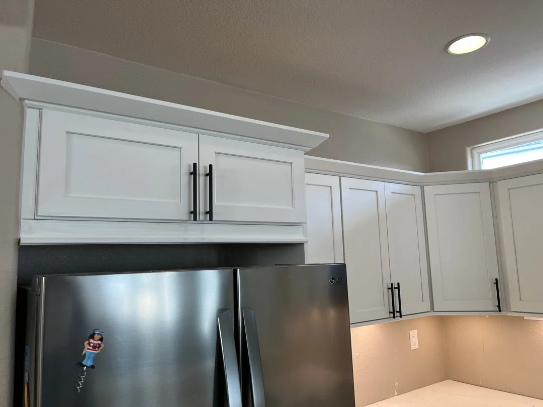 cabinet trim install.jpg