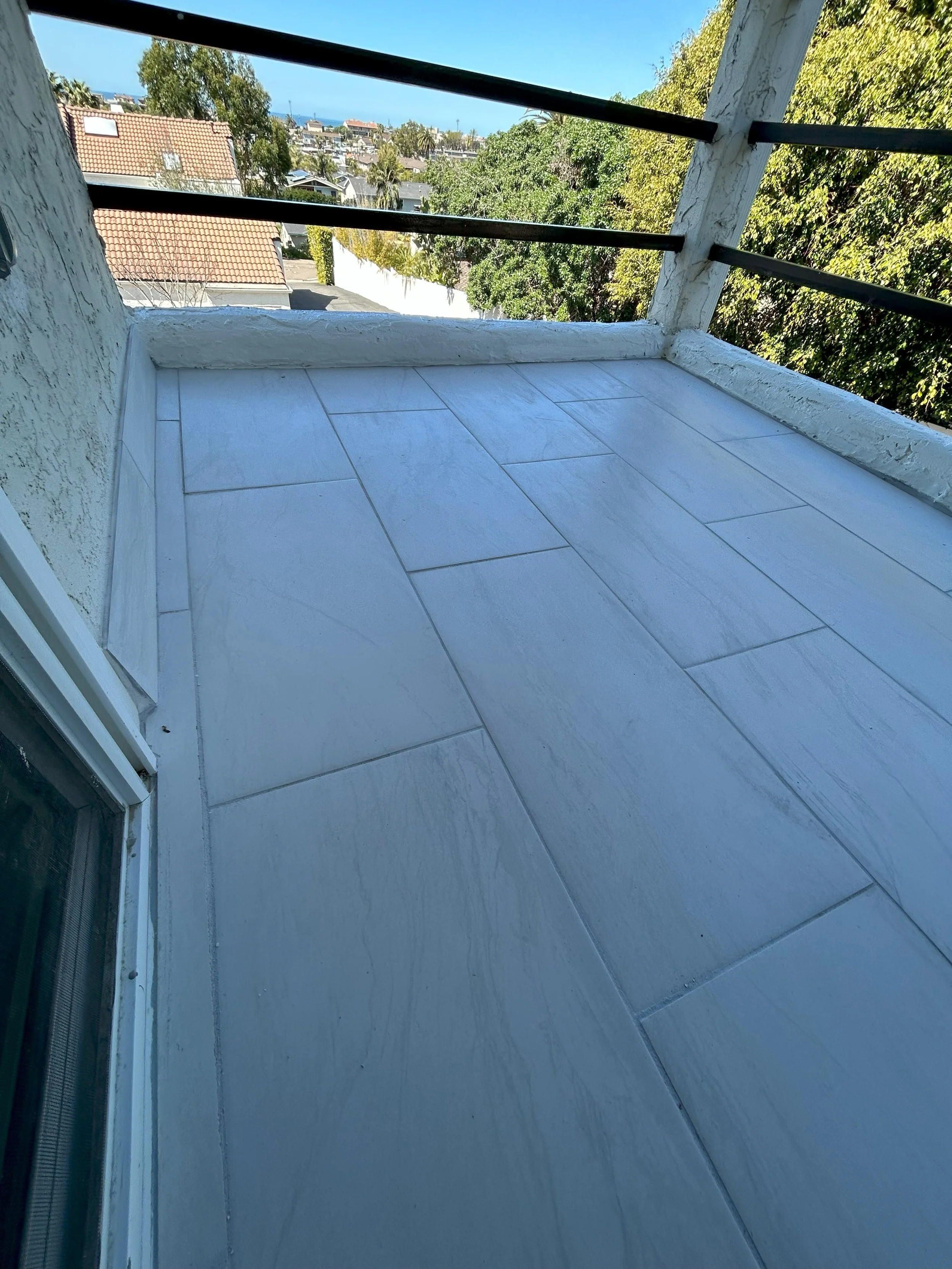 Re-tiled patio - client reported previously tiler installed incorrectly and the patio wasn't draining correctly and leaking in to their bedroom. Ripped it all up and re-tiled it correctly!