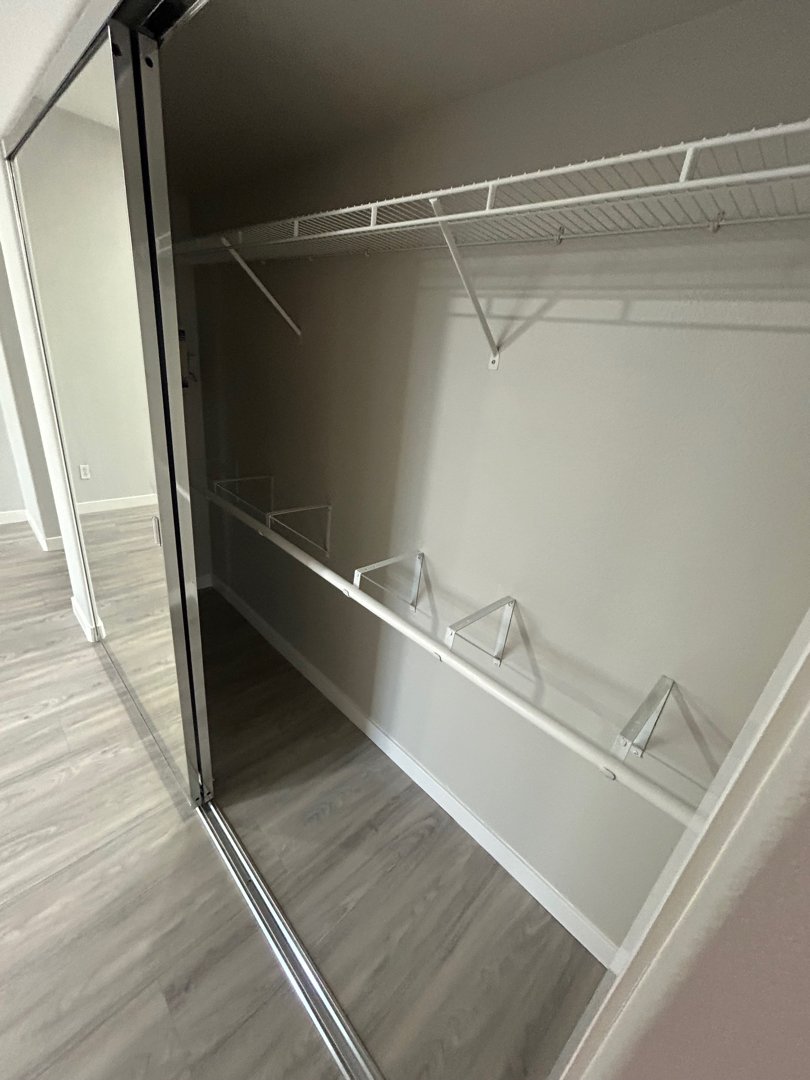 Remodeled closet with racks in San Diego