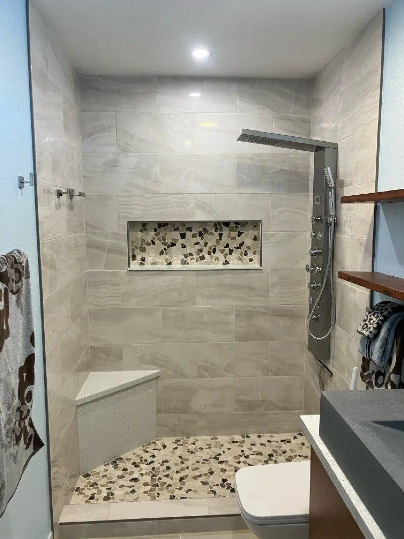 HUGE Handyman remodeled shower with a bench, a niche, and new plumbing in San Diego