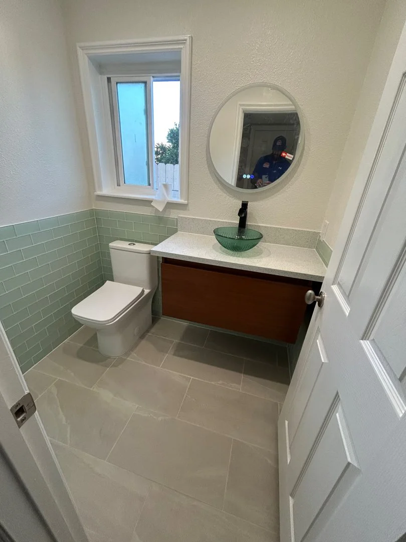 Remodeled bathroom with wall and floor tile in San Diego