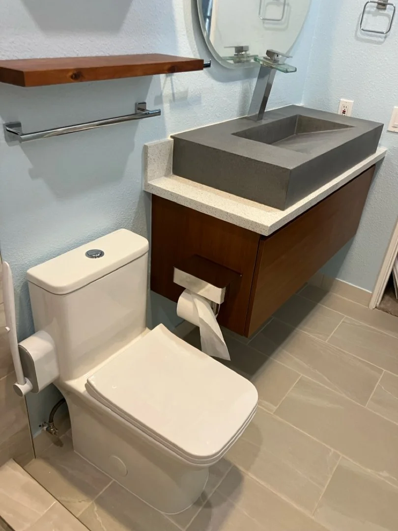 towel rack, new toilet , and faucet installed by HUGE Handyman in San Diego modern bathroom
