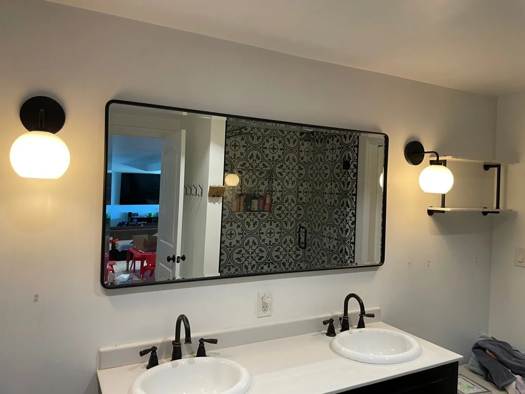 new mirror professionally installed by HUGE Handyman in modern San Diego bathroom