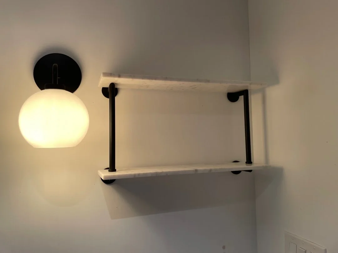 light sconces and marble floating shelves installed by HUGE Handyman in San Diego