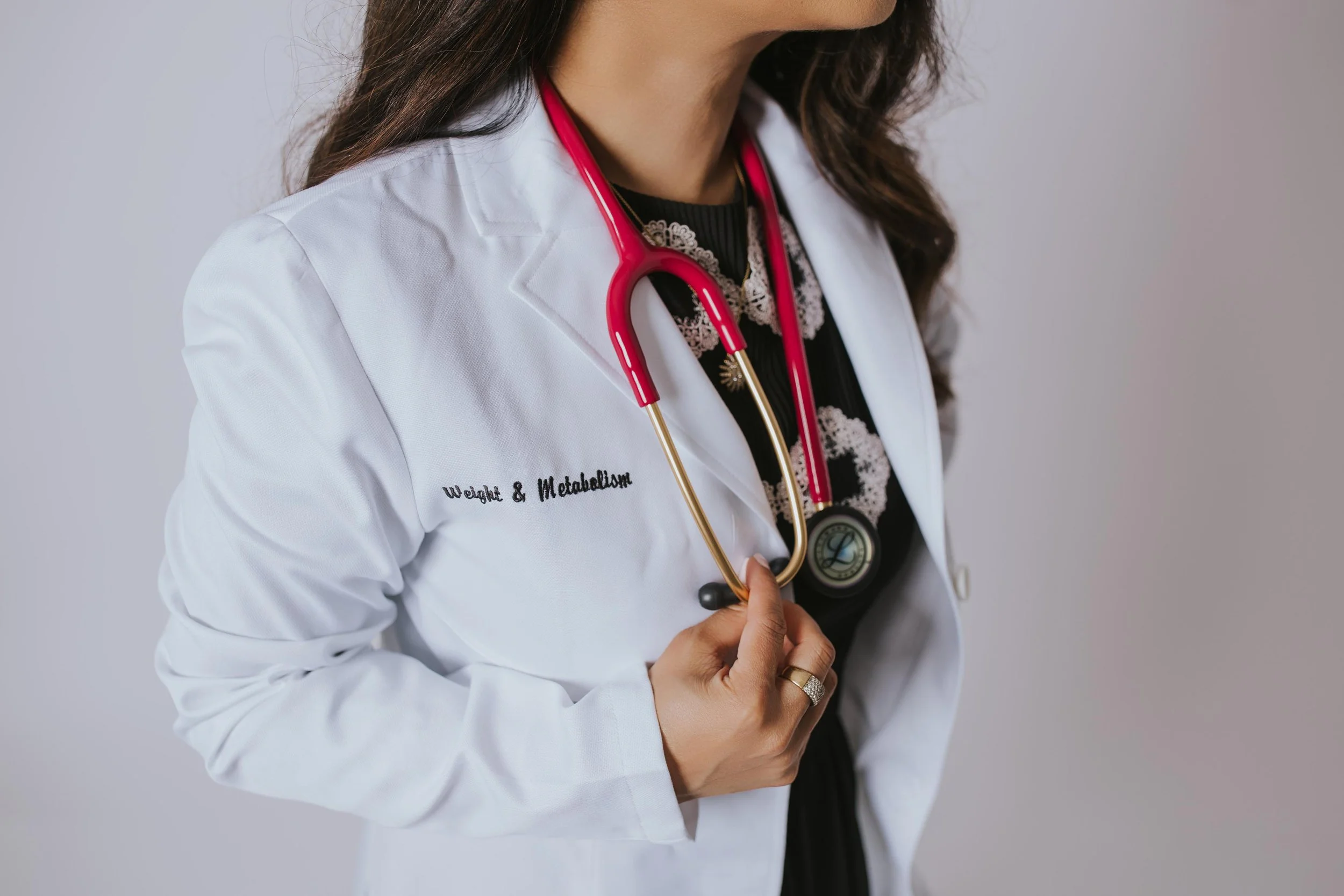 close up of Dr. Sharma's lab coat and stethoscope