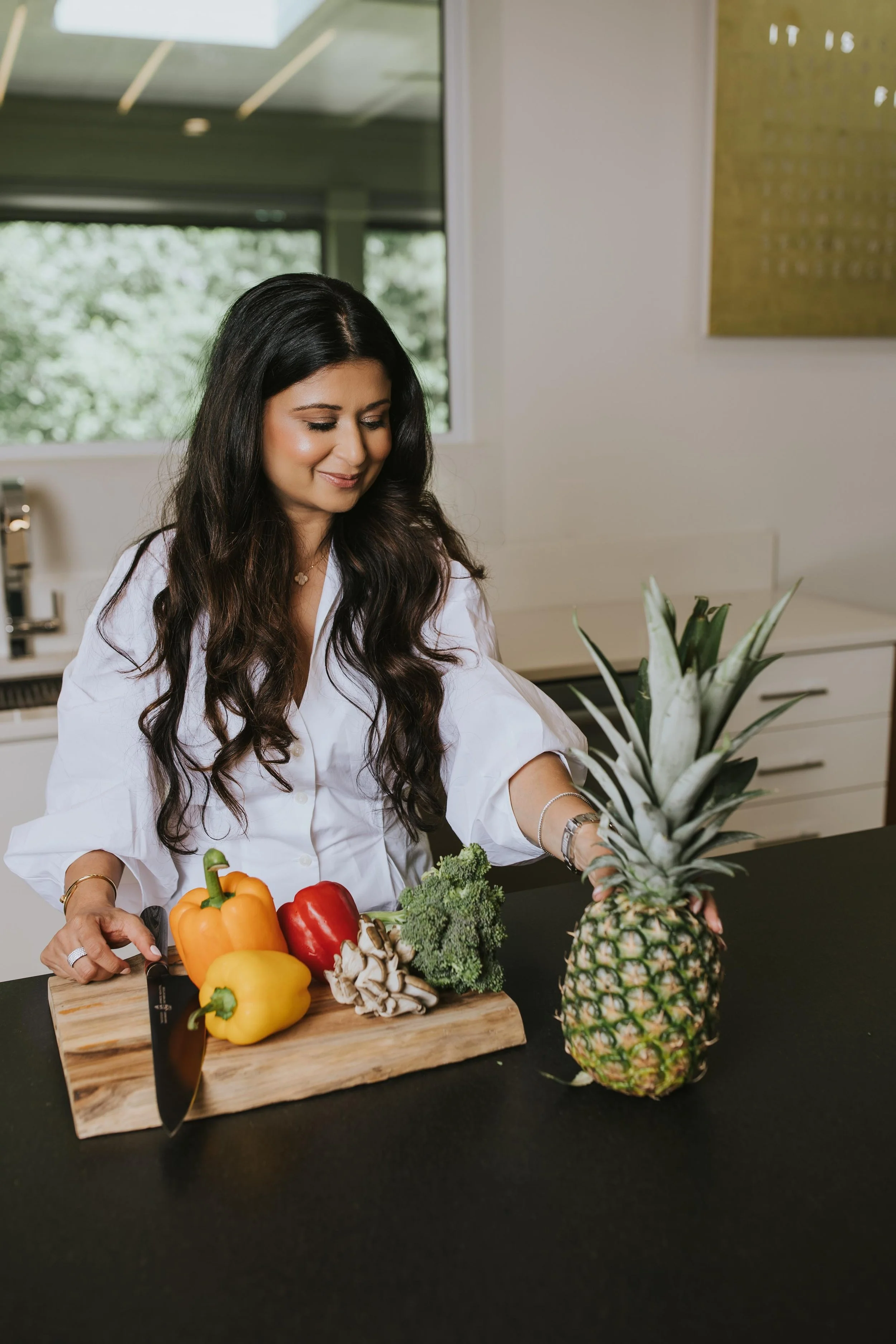 closeup of a cutting board with fruits and veggies