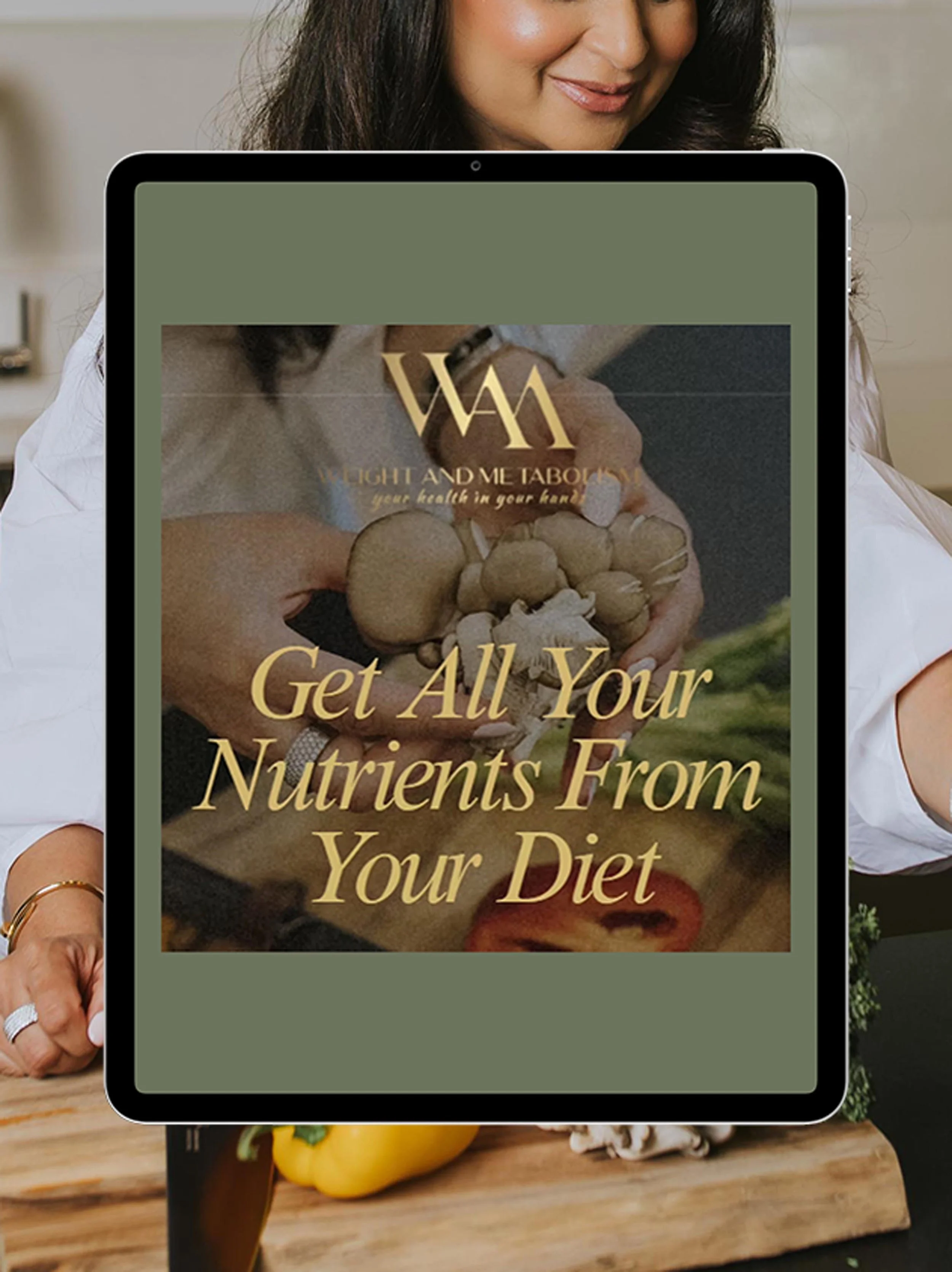 iPad displaying the cookbook cover, with the title "Get All Your Nutrients from Your Diet"