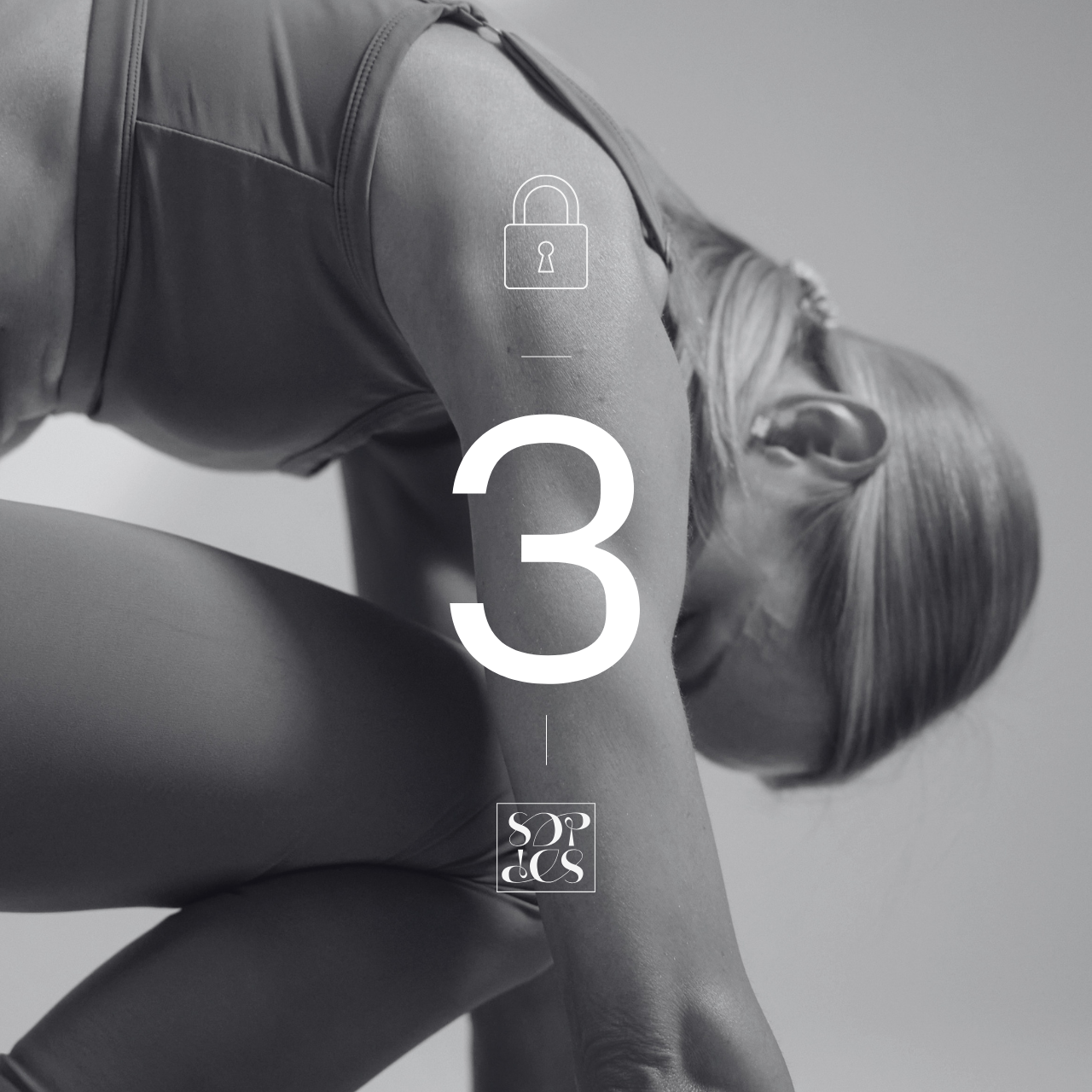 A woman doing a forward bend yoga pose, wearing athletic clothing, in black and white.