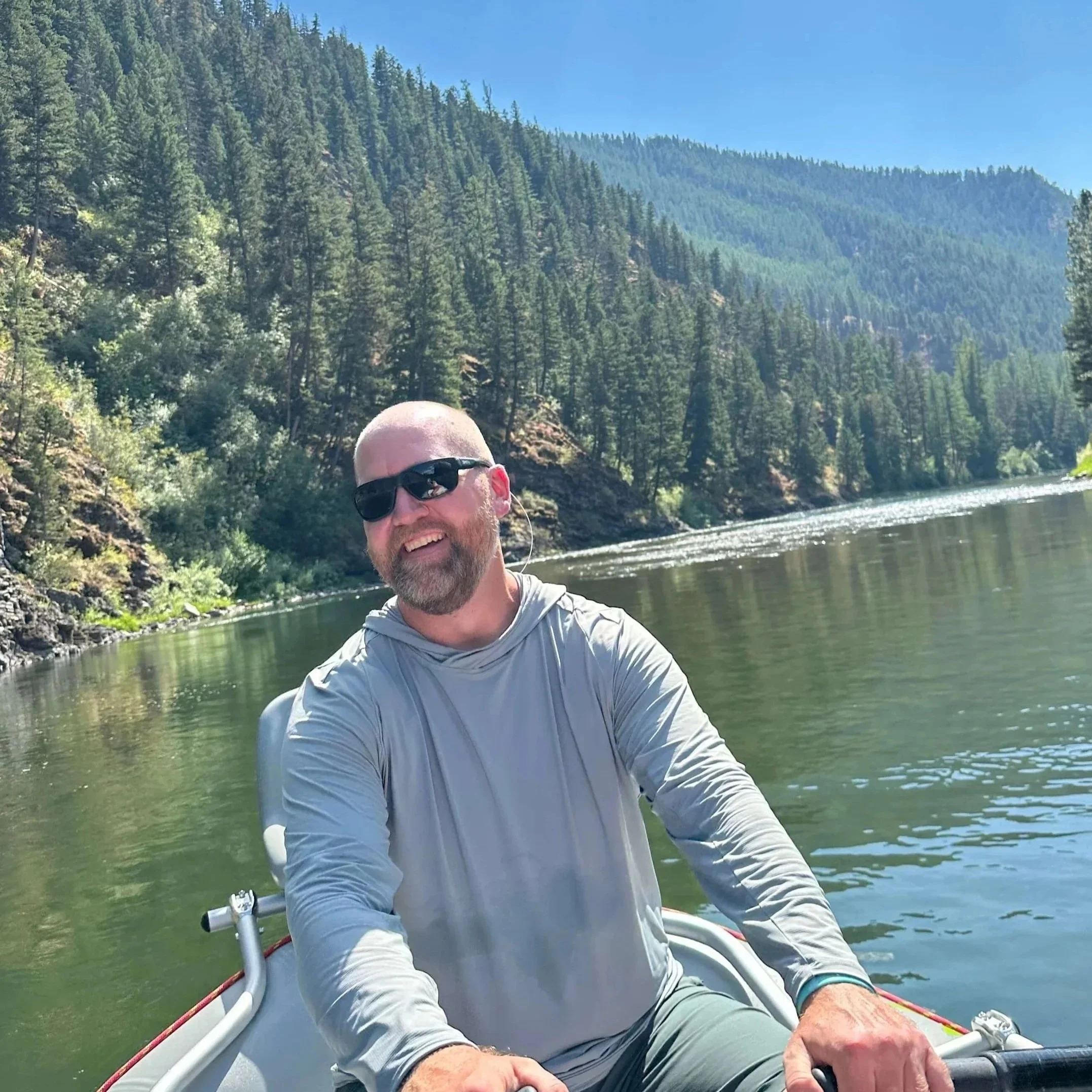Picture of founder Adam Steffen river rafting