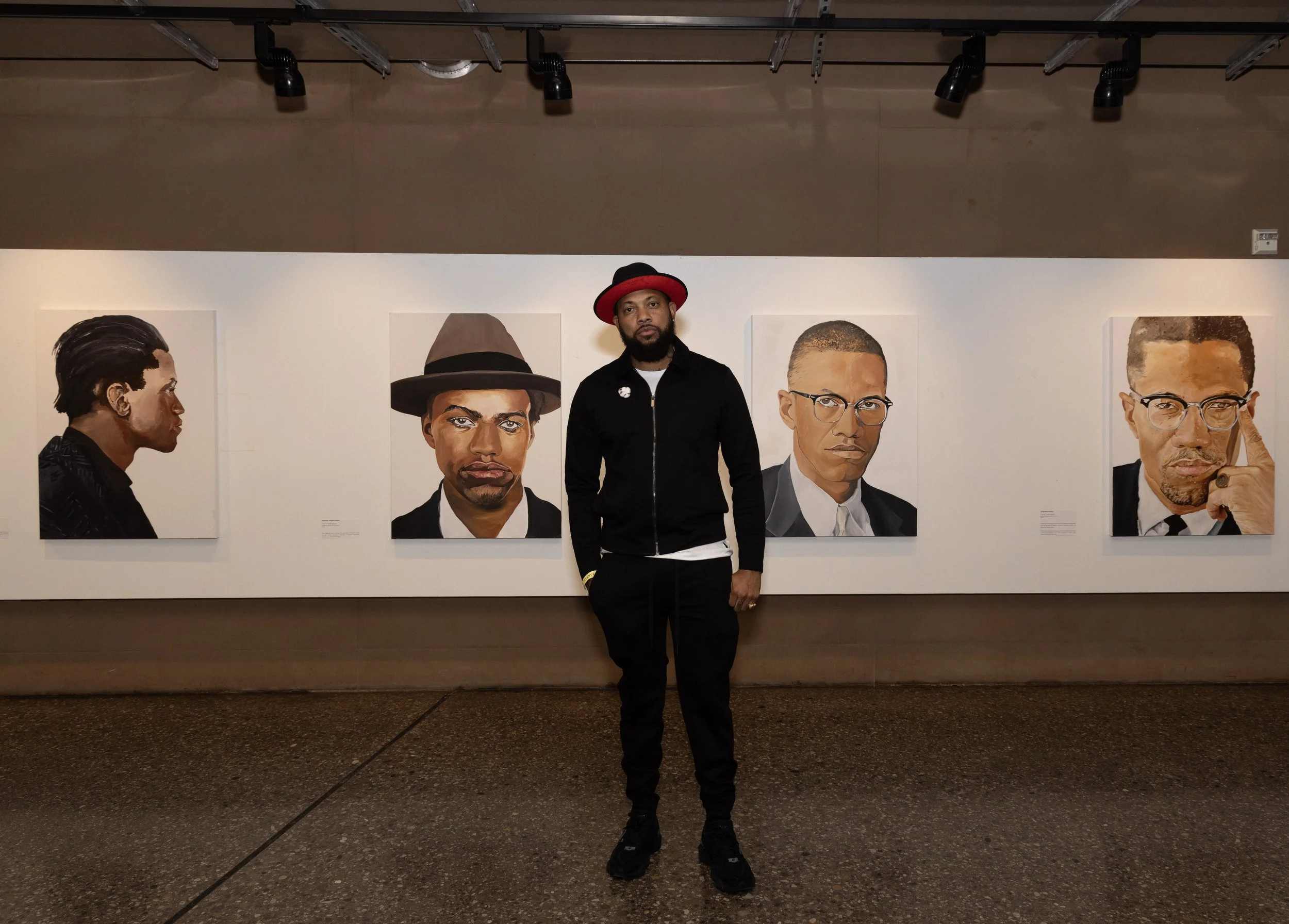 "Evolution of Malcolm" Artist Courtney "Yard$" Haywood, Photograph by Dre Crichton