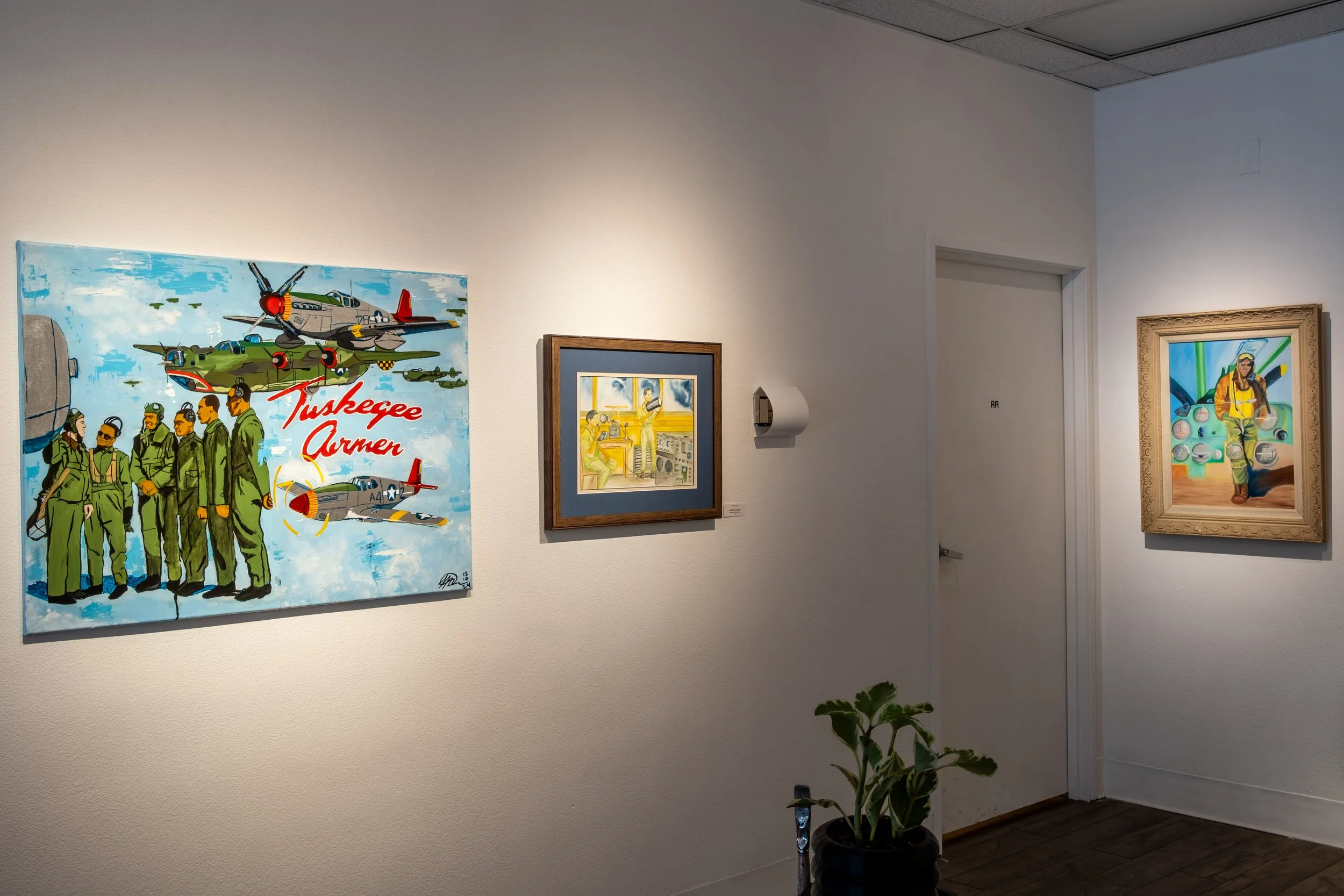 (L to R) "Born to Fly" by Terrance Richard, 2024 ; "Air Traffic Controlmen" by Randy Proby, 1997 ; "...Peaceful Moments" by Randy Proby, 1998
