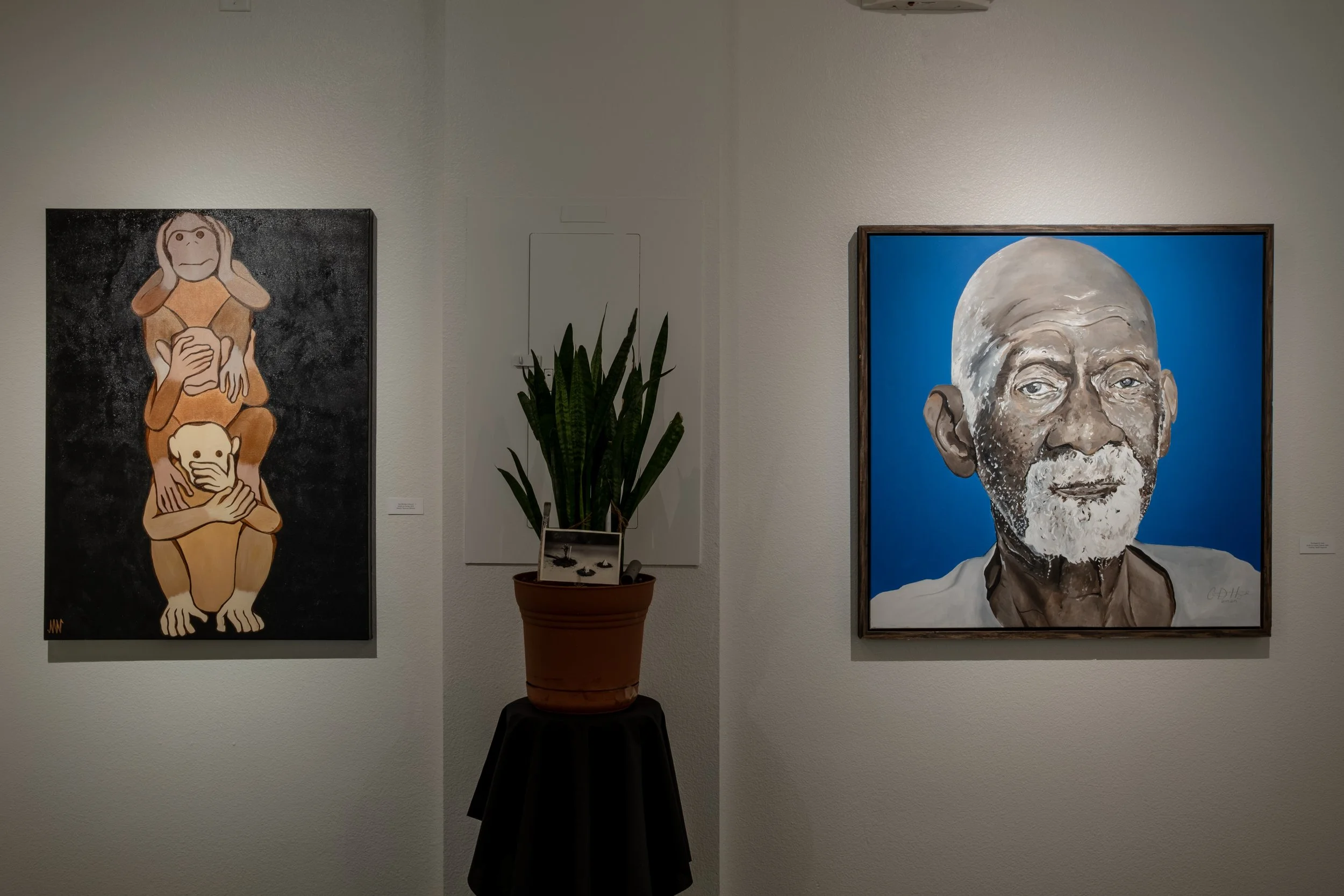 "Stop Monkey'n Around" Painting by Malachi Sparrow Williams; "The Healer (Dr. Sebi)" Painting by Courtney Yard$ Haywood