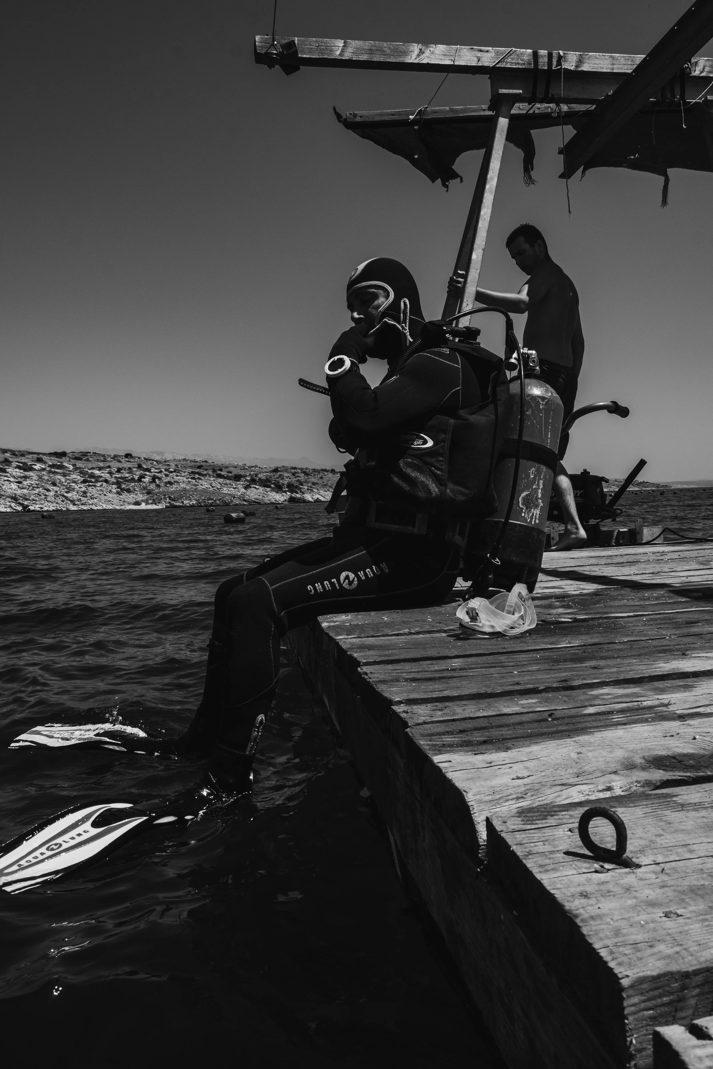 A diver going into the sea.