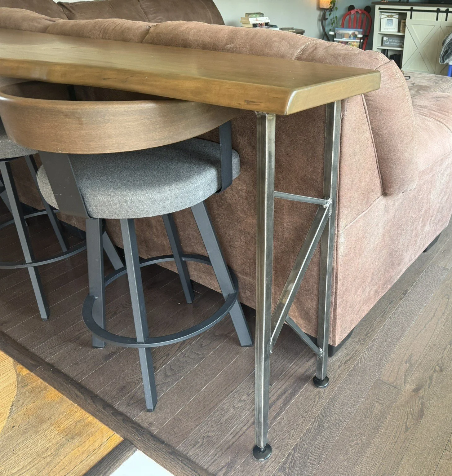 Rustic live edge black cherry console table with custom designed and built steel legs, and matching cutting board