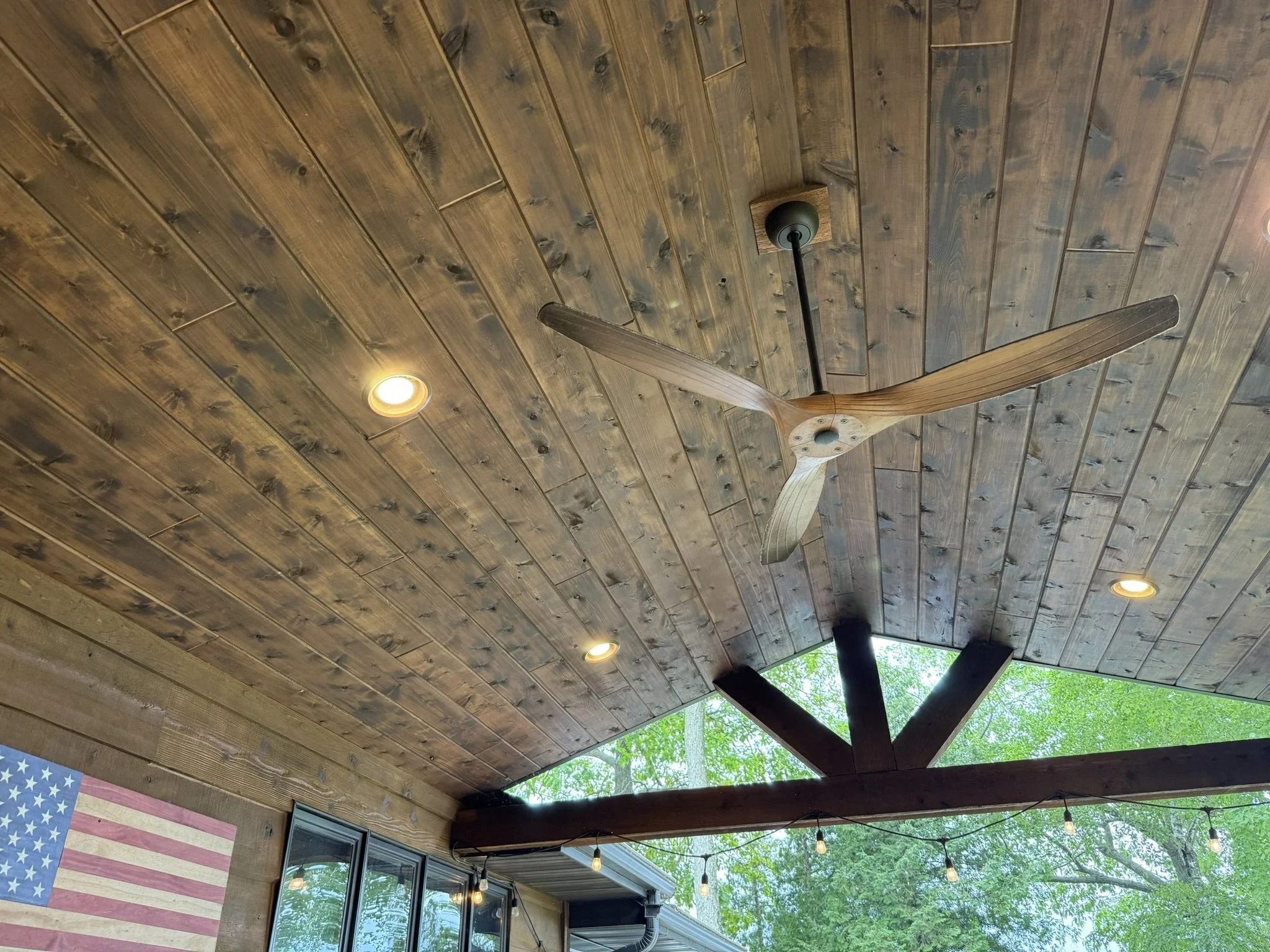 Stained rustic cedar tongue and groove ceiling, with inset led can lighting 