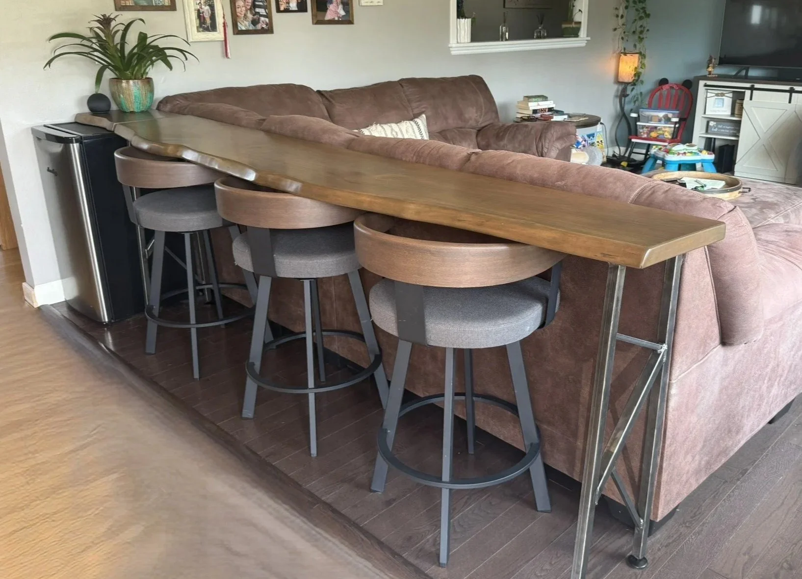 Rustic live edge black cherry console table with custom designed and built steel legs, and matching cutting board