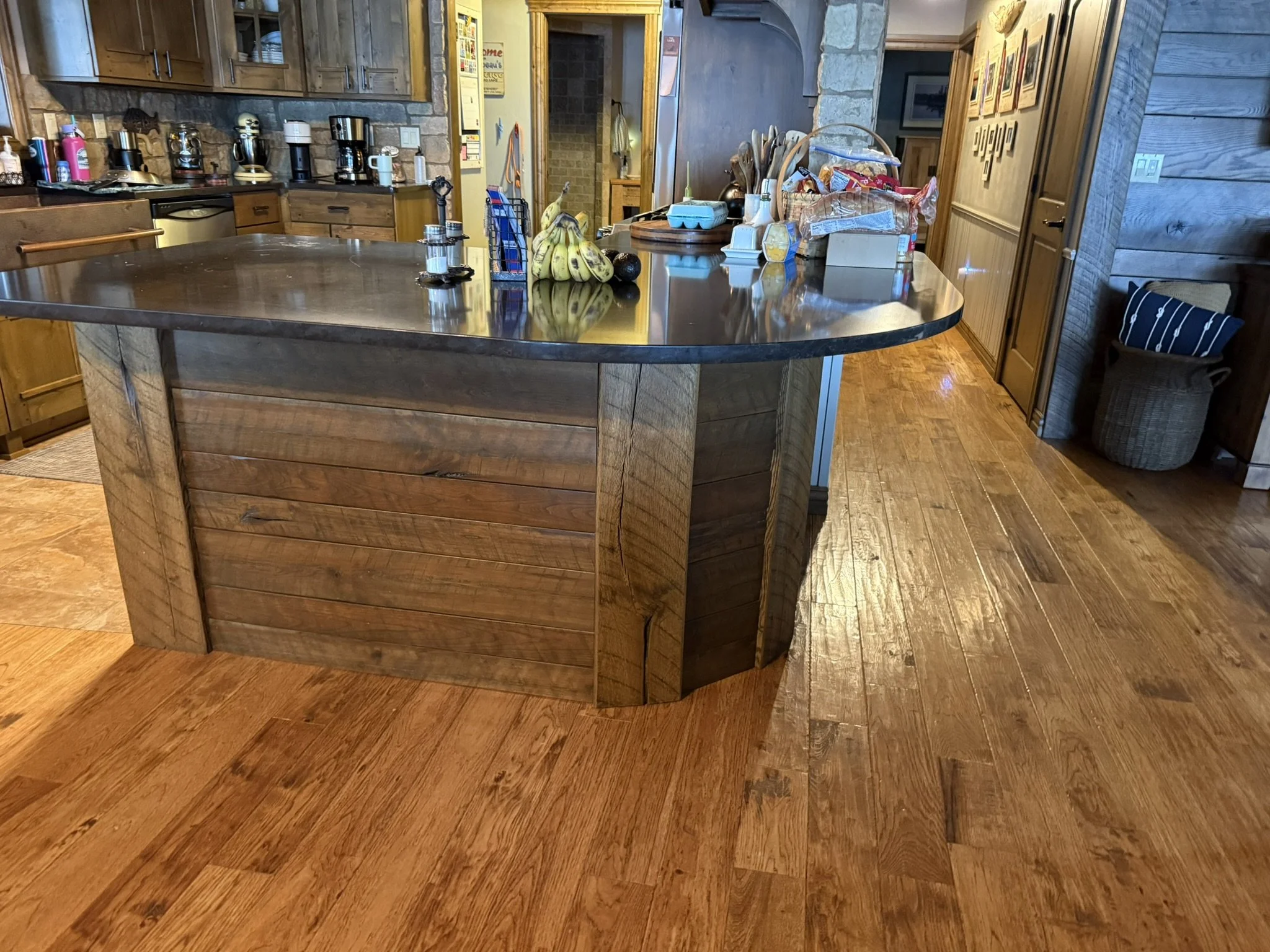 Rustic stained oak cabinet cladding with original saw marks